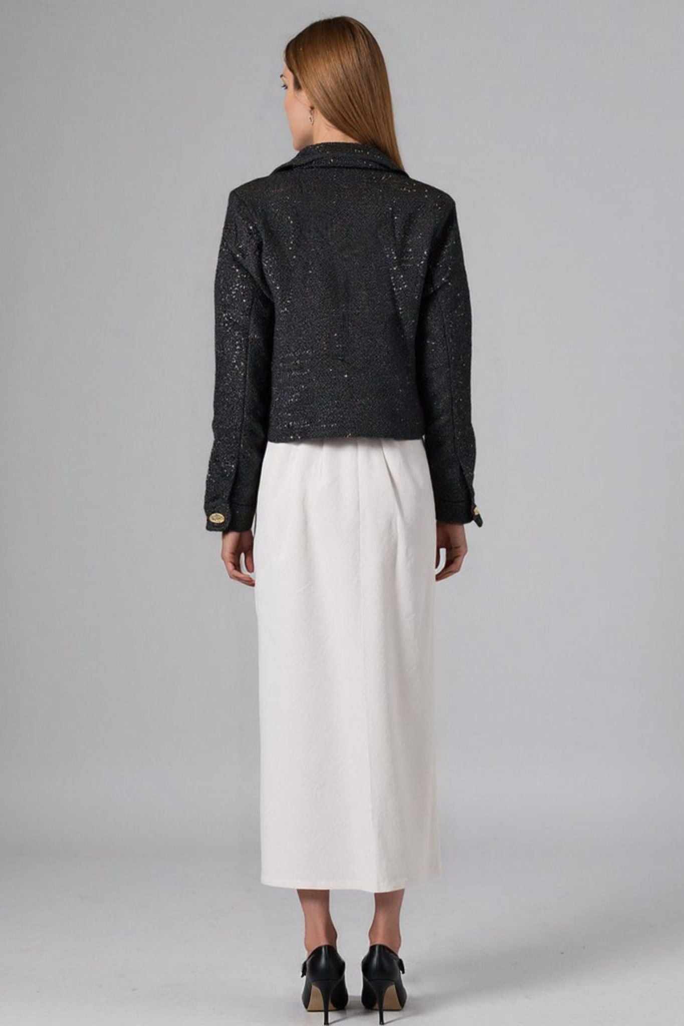 Giacca corta in tweed nero con paillettes