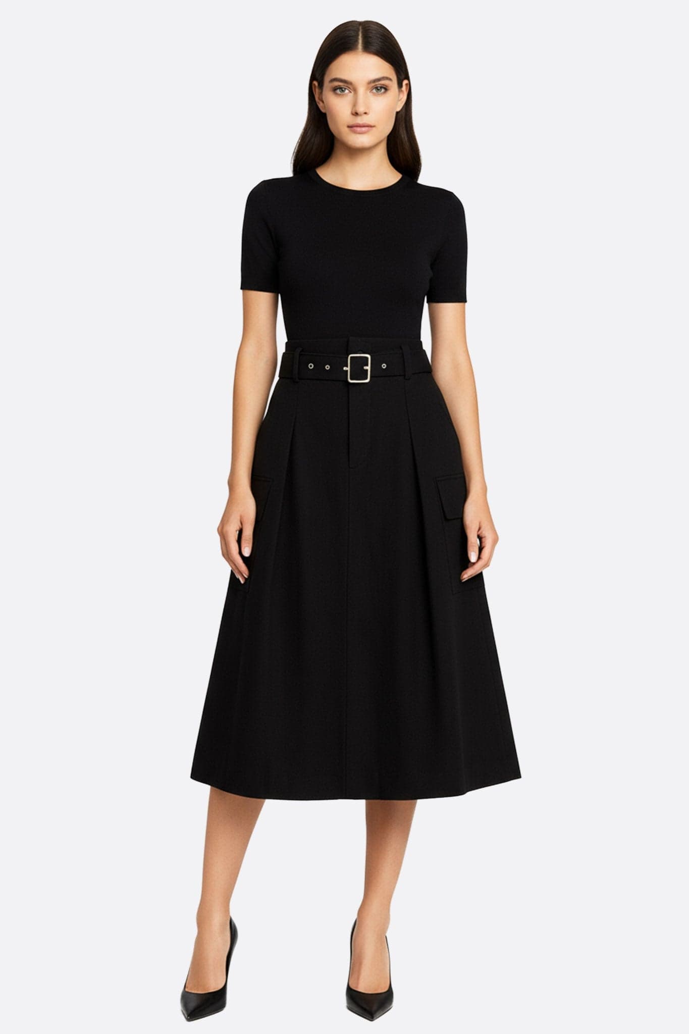 Elegante gonna midi nera con cintura e tasche oversize, perfetta per un look chic e moderno quotidiano