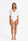 White one-piece swimsuit with openwork cape