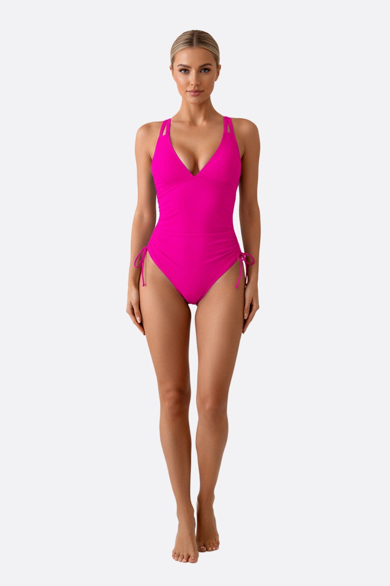 Bañador de una pieza fucsia con tiras ajustables, diseño moderno y favorecedor para disfrutar del verano.