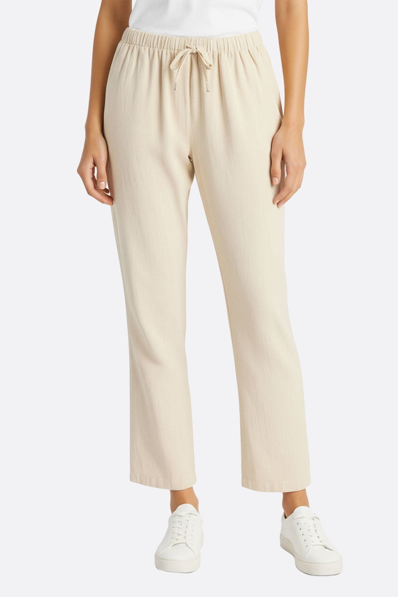 Pantalon léger en lin beige à taille élastique, parfait pour un look décontracté et élégant au quotidien ou en soirée.