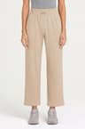Pantalon large beige en tissu technique à coupe 7/8