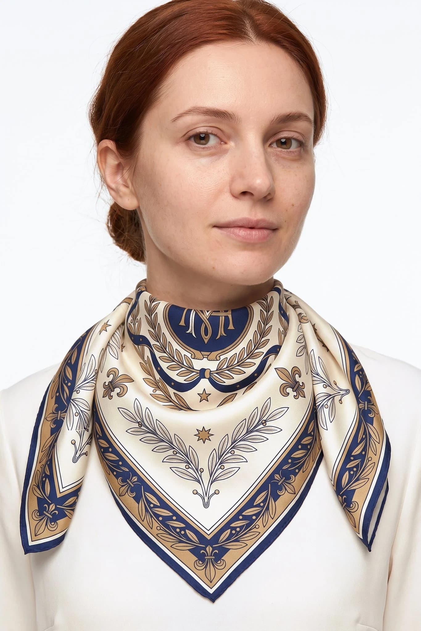Silk scarf 70 Midnight Blazon worn tied around a woman's neck, studio view