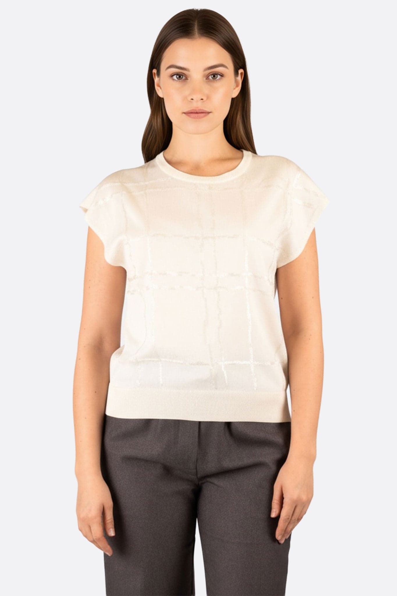 Pull sans manches en maille raffinée blanche, parfait pour une tenue chic et moderne au quotidien.