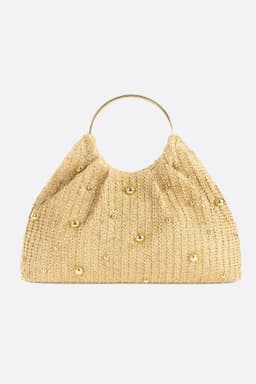 Cabas in rafia dorata ornato di perle luminose, accessorio chic per una giornata di sole o una serata elegante