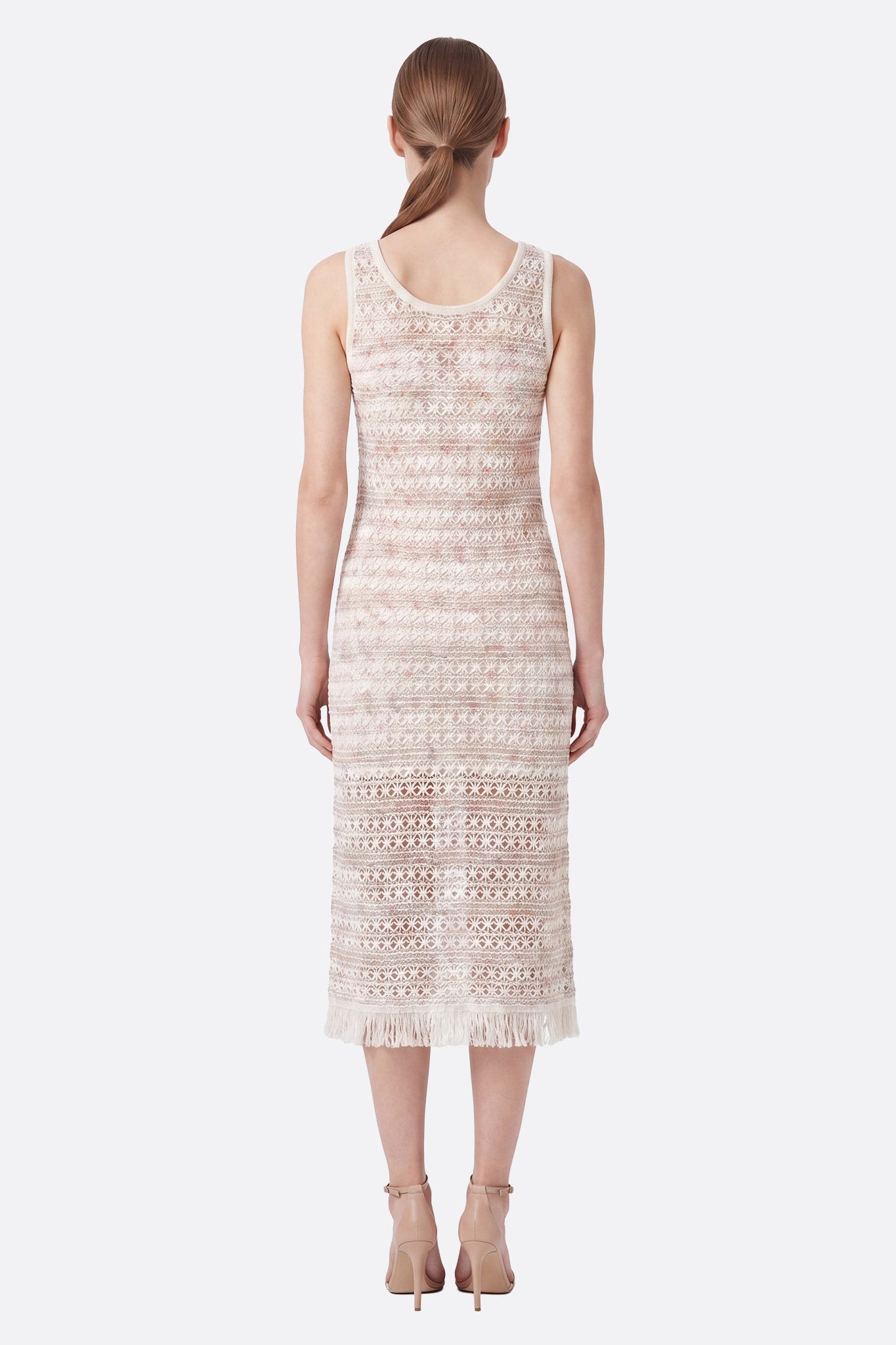 Ecru textured midi dress with gradient pattern worn back with fringe at hem