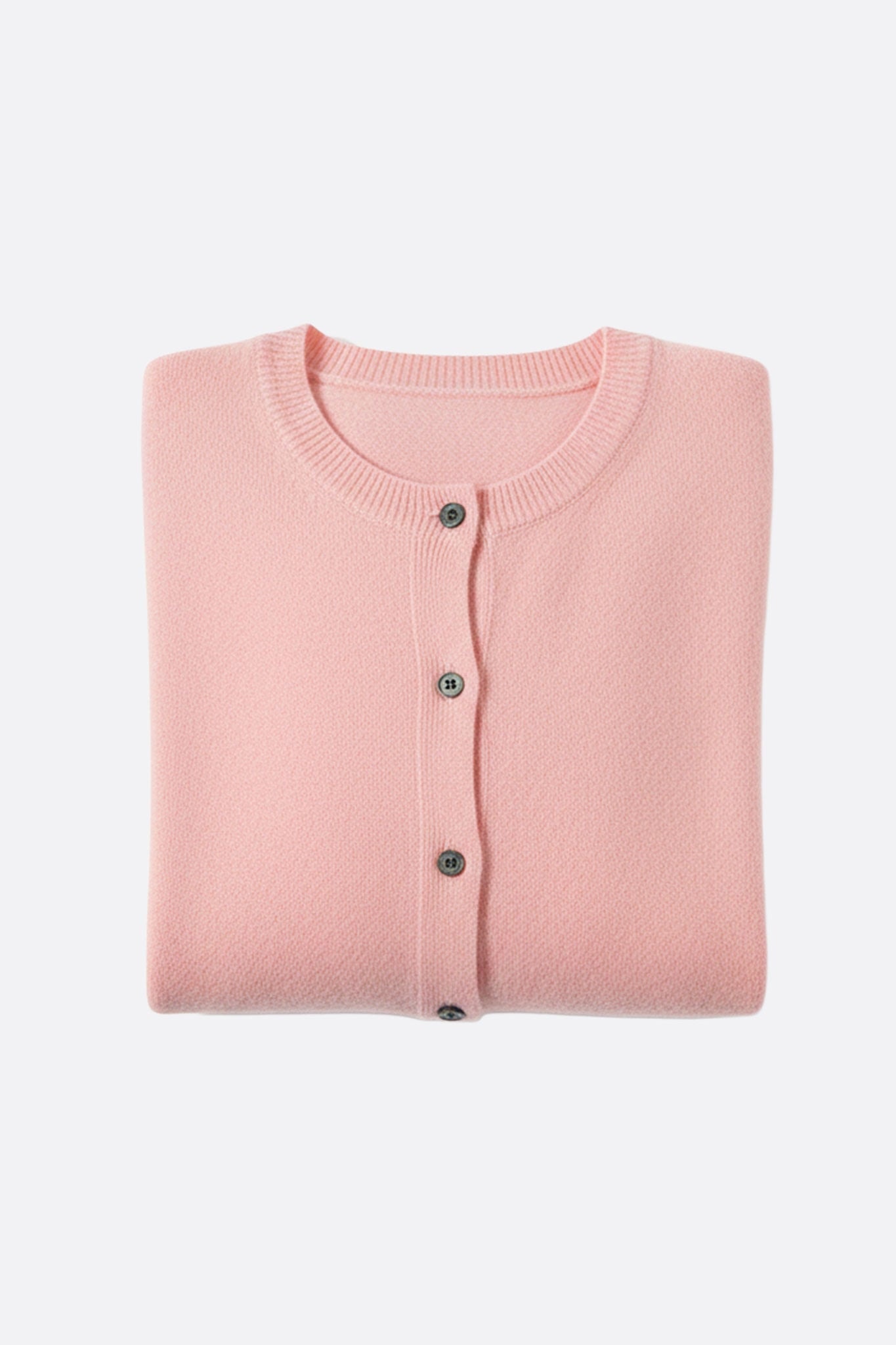 Vista laterale di un cardigan in lana rosa cipria, che mette in luce la finezza delle maglie e il suo look chic per...