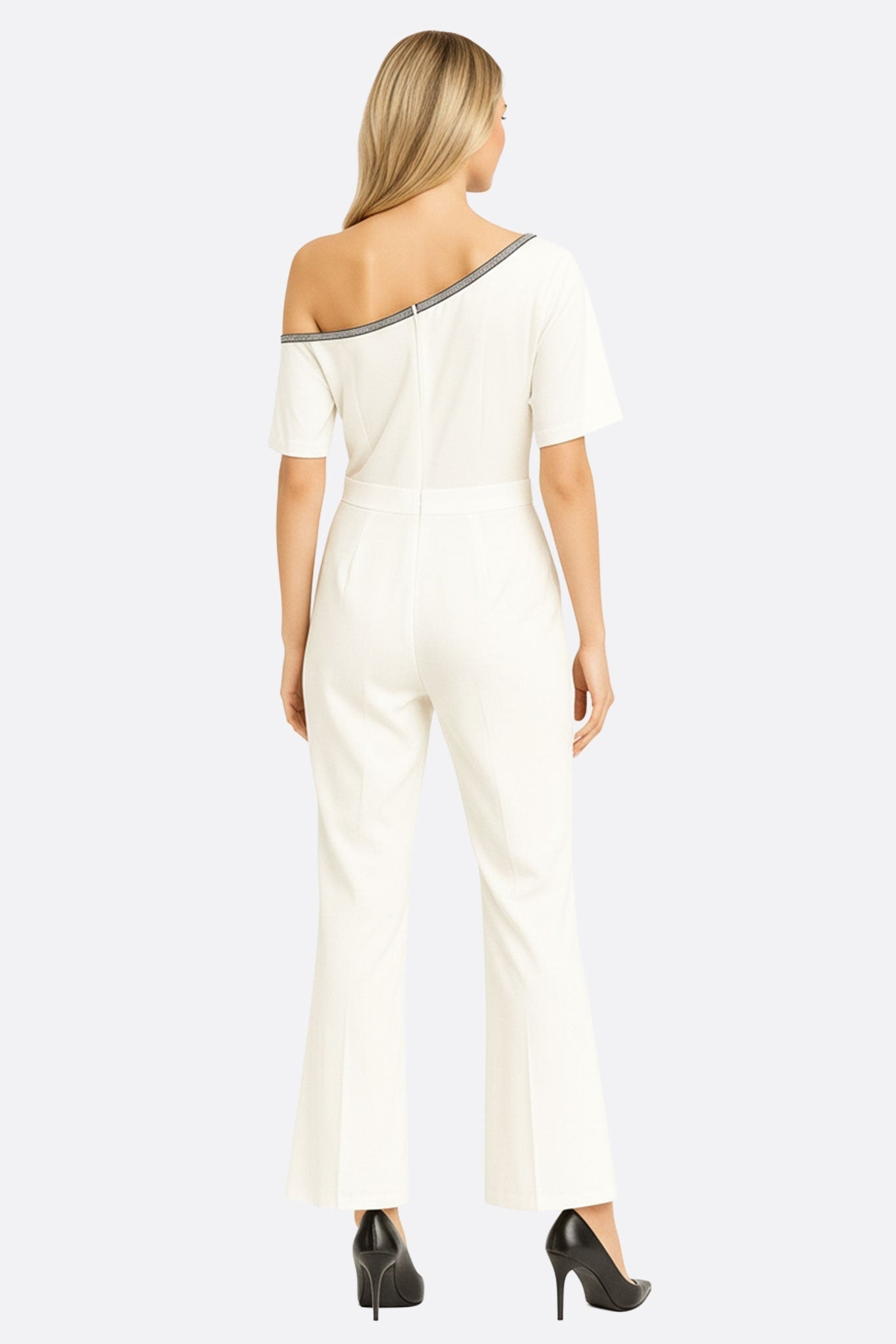 Close-up on the collar of the white asymmetric jumpsuit, underscoring its chic allure and refined contrasting detail