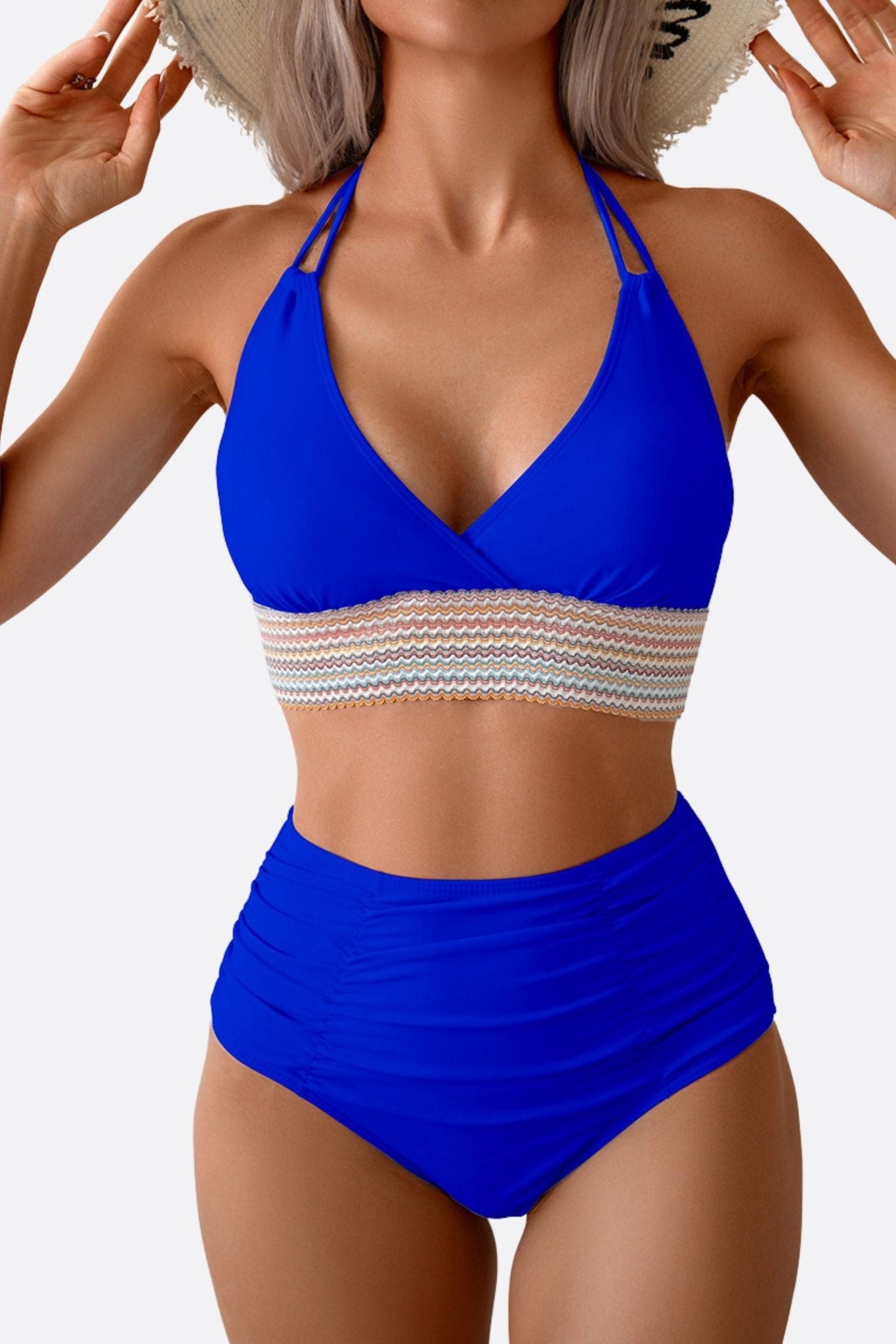 Close-up of the royal blue swimsuit, highlighting its colorful stripes, ideal for a chic summer getaway.