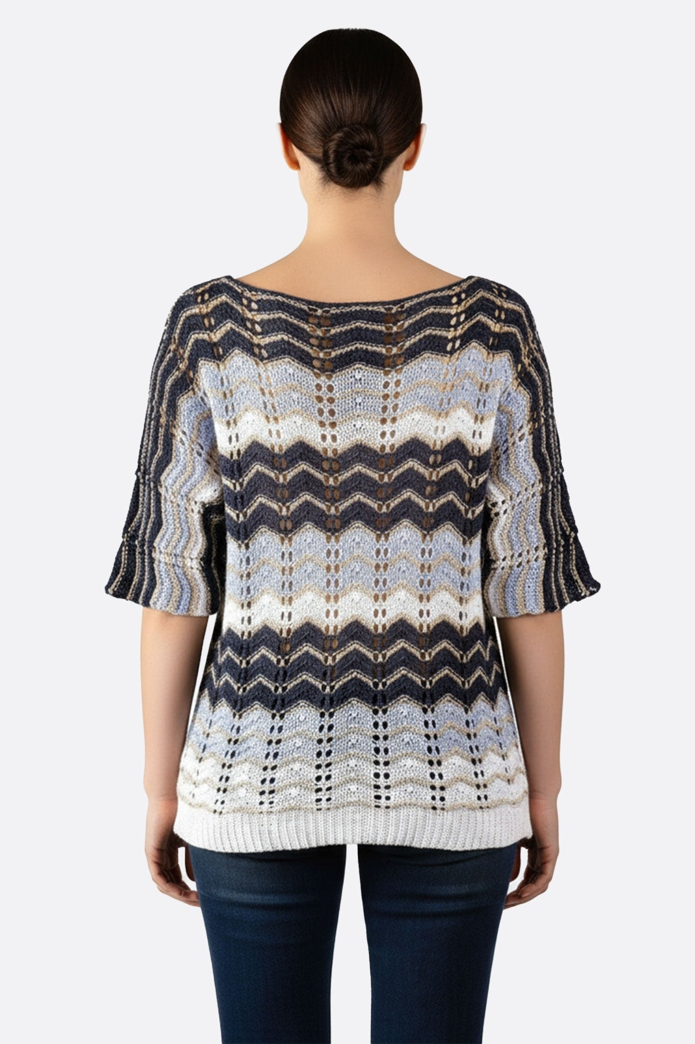 Detailed view of the women's blue and white openwork knit pullover with chevron pattern, perfect for a modern, stylish look.