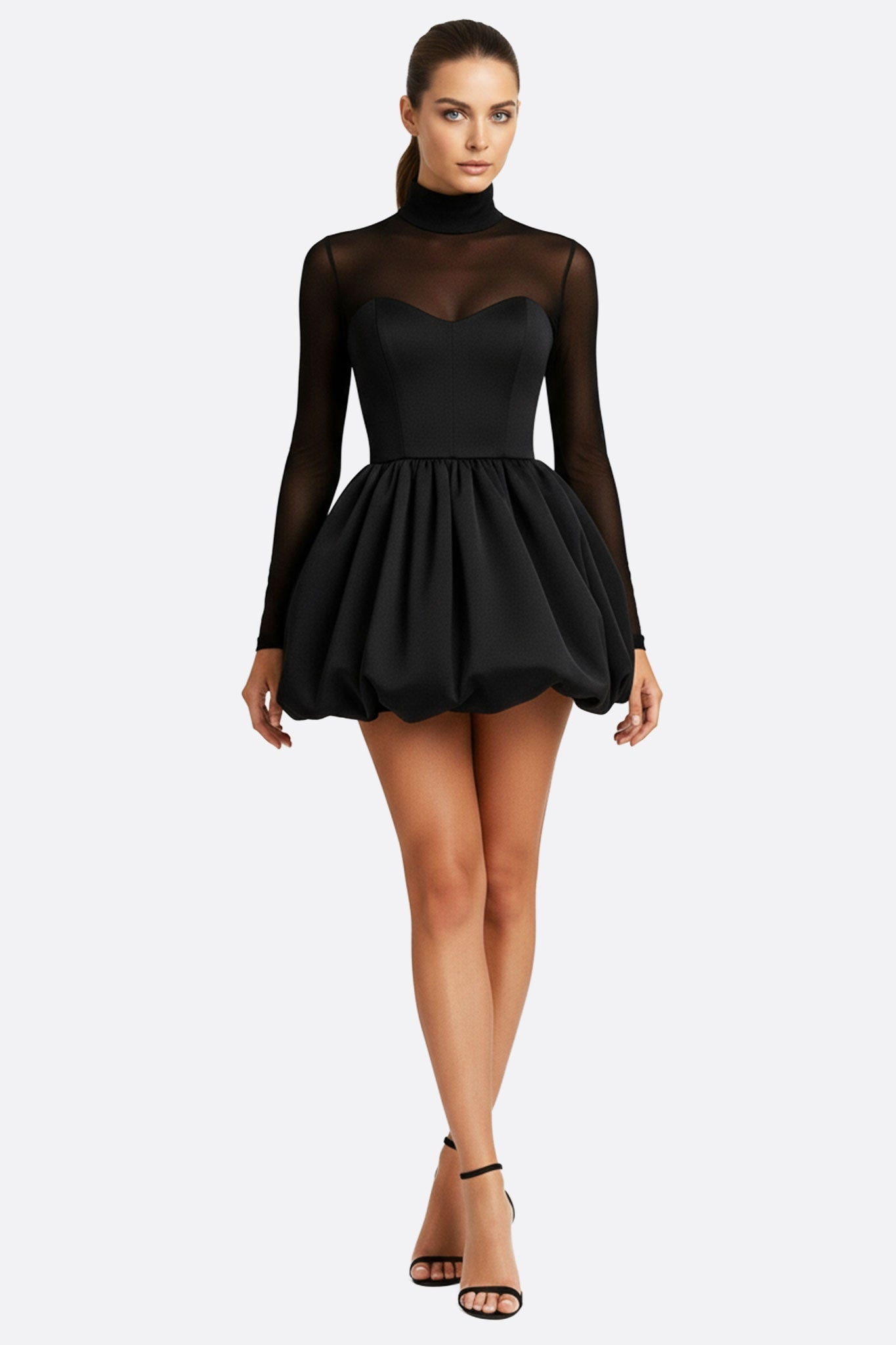 Robe de soirée chic en noir, silhouette bouffante, manches en tulle transparent pour une allure raffinée.