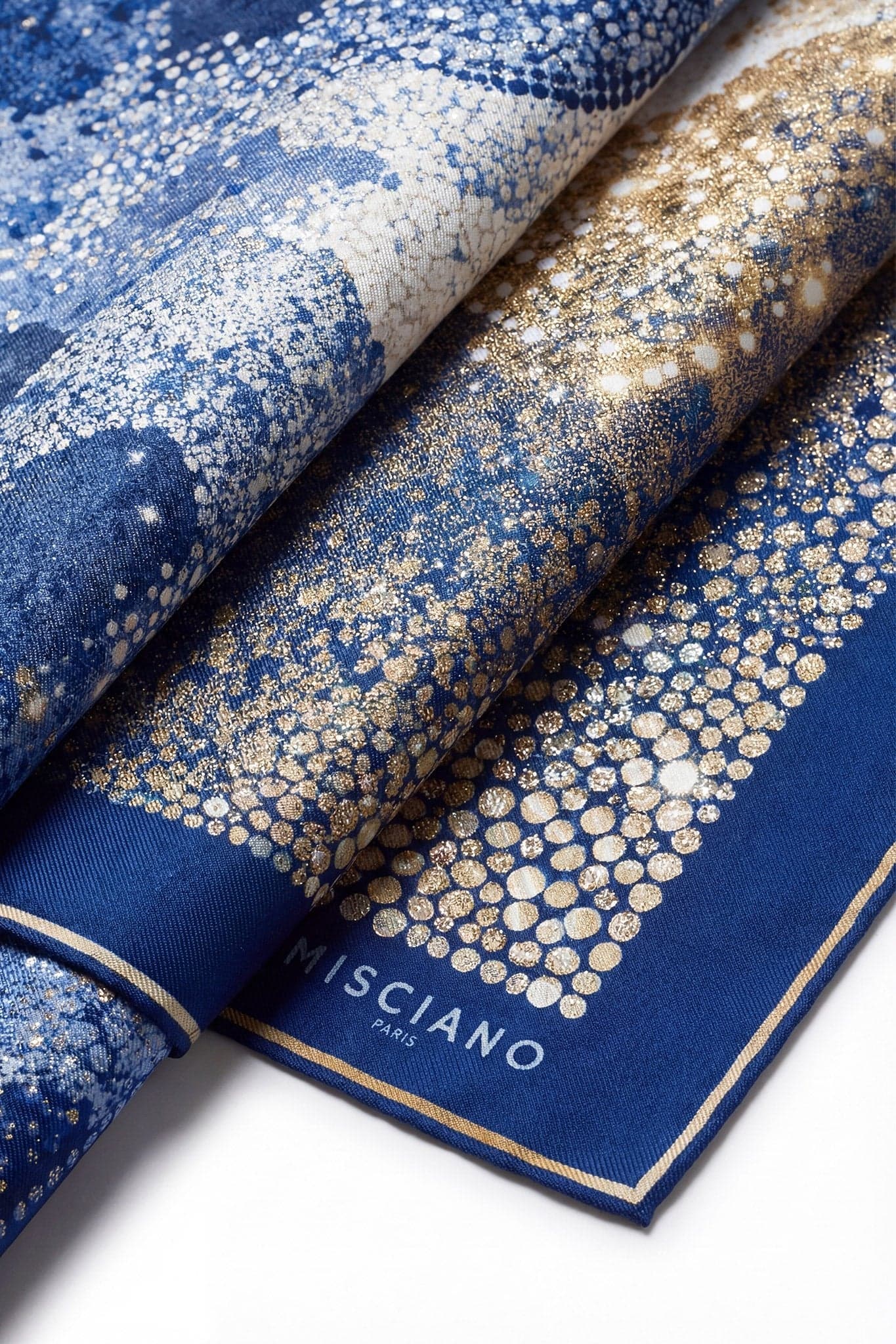 Alternate perspective of the Mosaïque Nocturne silk carré, revealing a stunning interplay of deep blue and radiant gold...