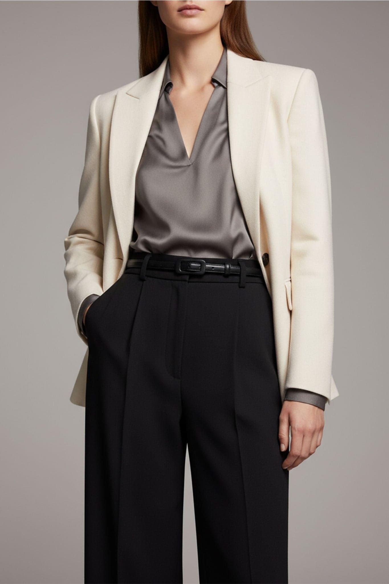 Refined detail of the rectangular buckle of the fine black belt, an eco-friendly accessory for a chic style at the...