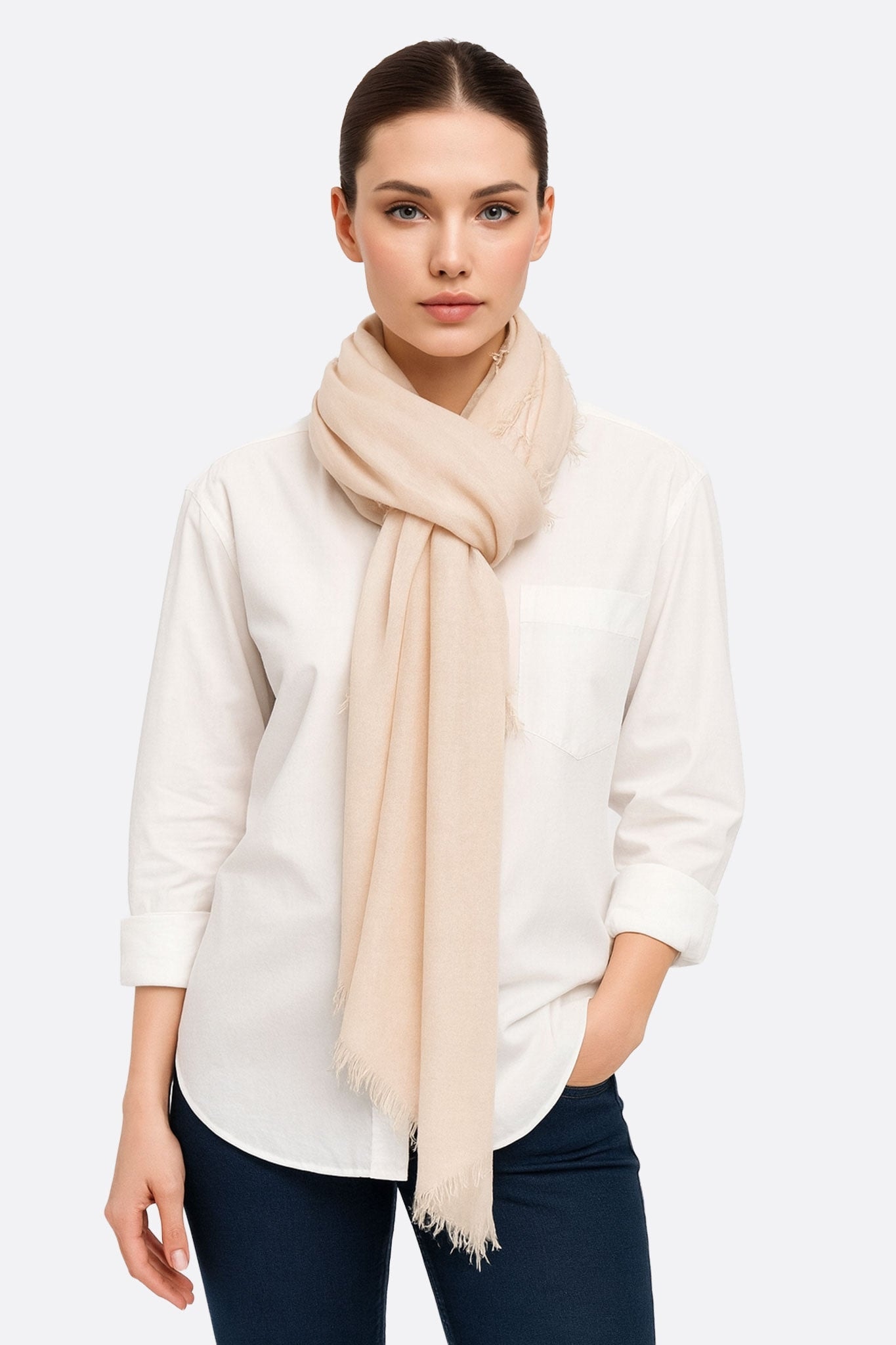 Soft pink modal-wool-cashmere scarf draped elegantly, perfect for adding a chic touch to any casual or formal outfit.