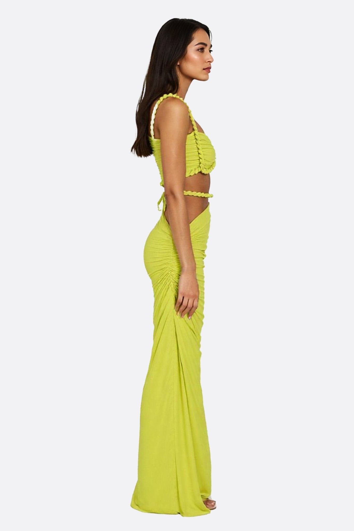 Detail of the elegant drape of the lime green beachwear set, asymmetric skirt, ideal for a summer getaway.