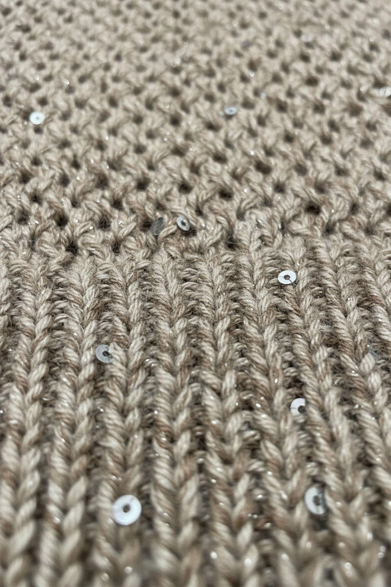 Detail of the sand beige openwork zipped vest in cotton and tencel, decorated with sequins, perfect for a refined look at...