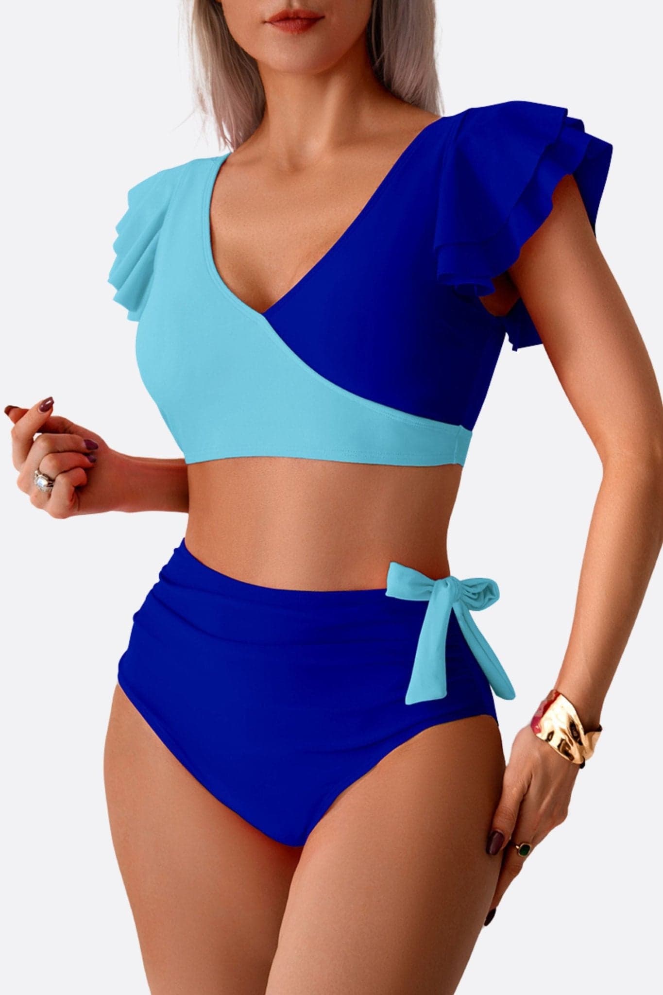 Aspect of the blue two-tone wrap bikini, highlighting its flattering cut and contemporary style for summer.