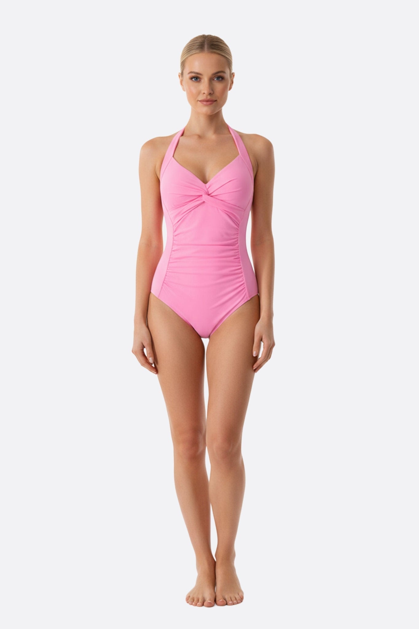 Delicate one-piece swimsuit in pale pink, tied at the front, perfect for an elegant day at the beach.