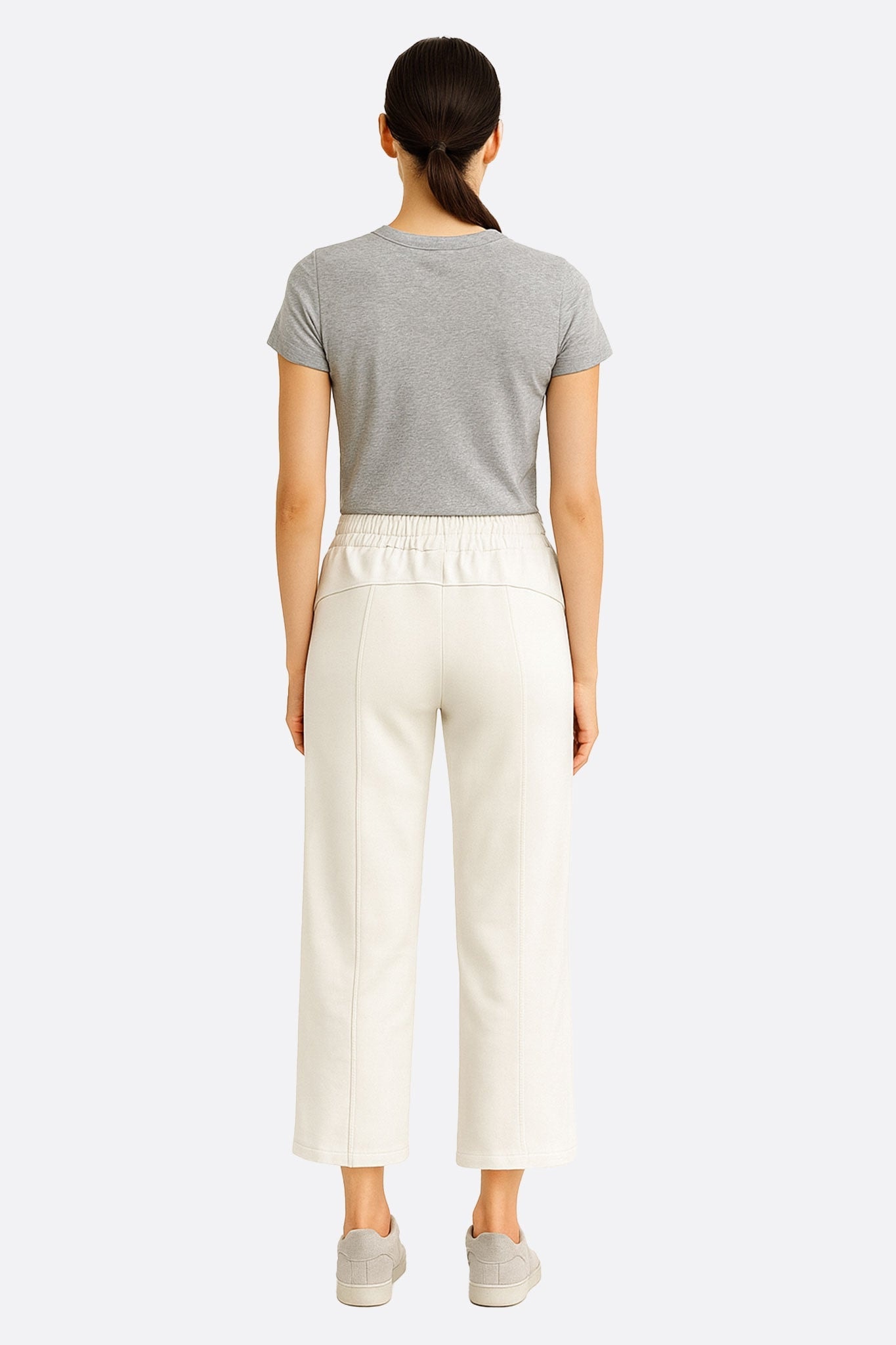 Alternative perspective of the white lounge pants 7/8 in technical fabric, perfect for an elegant and casual style.