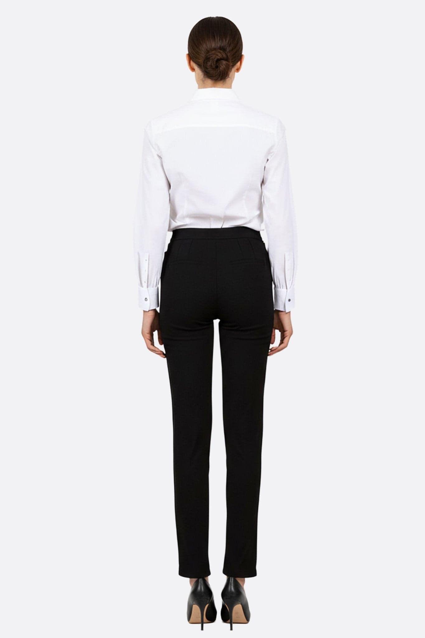 Detail of the black straight-leg trousers in gabardine, perfect for a timeless look on special occasions.