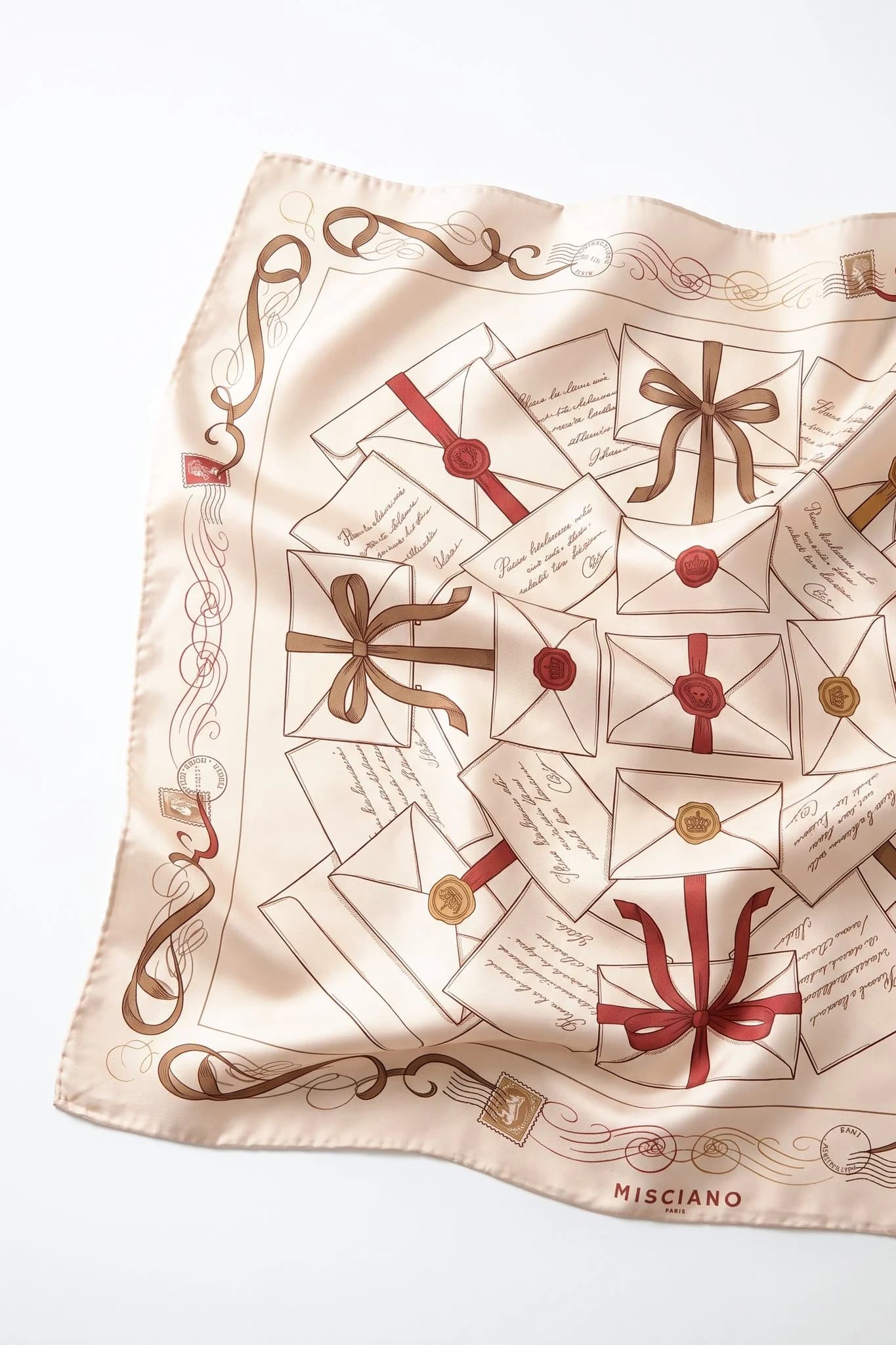 Close-up on the folds of the Love Letters silk scarf, silk twill and hand-rolled edge