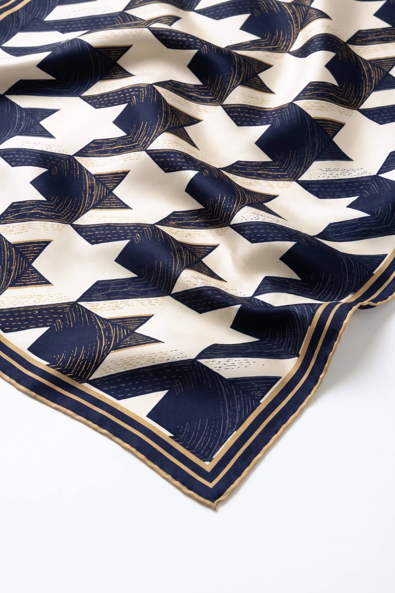 Close-up on the folds of the Parisian houndstooth silk square, silk twill and hand-rolled hem