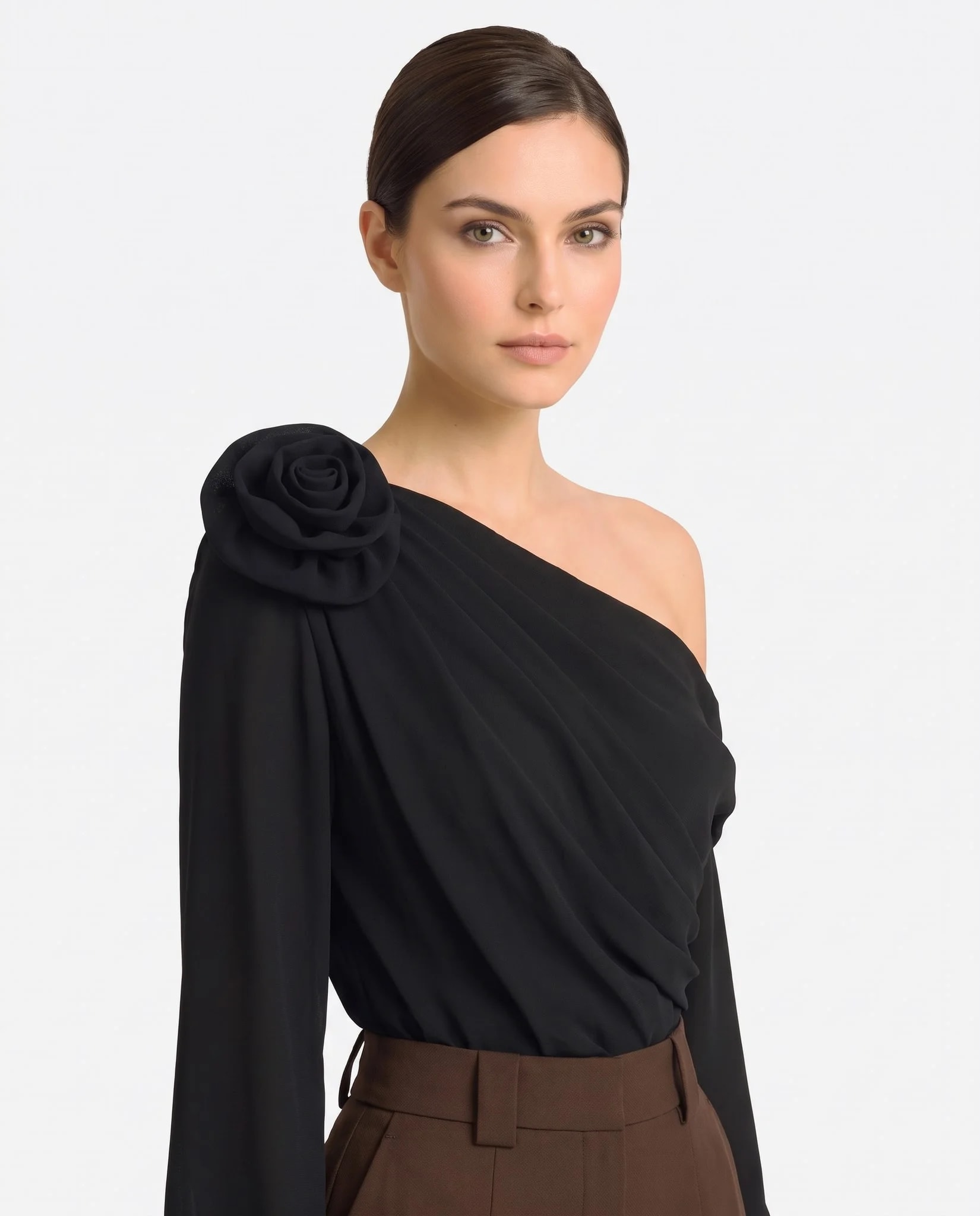 Bust of the black Misciano top: asymmetric neckline, opaque drape and bare shoulder