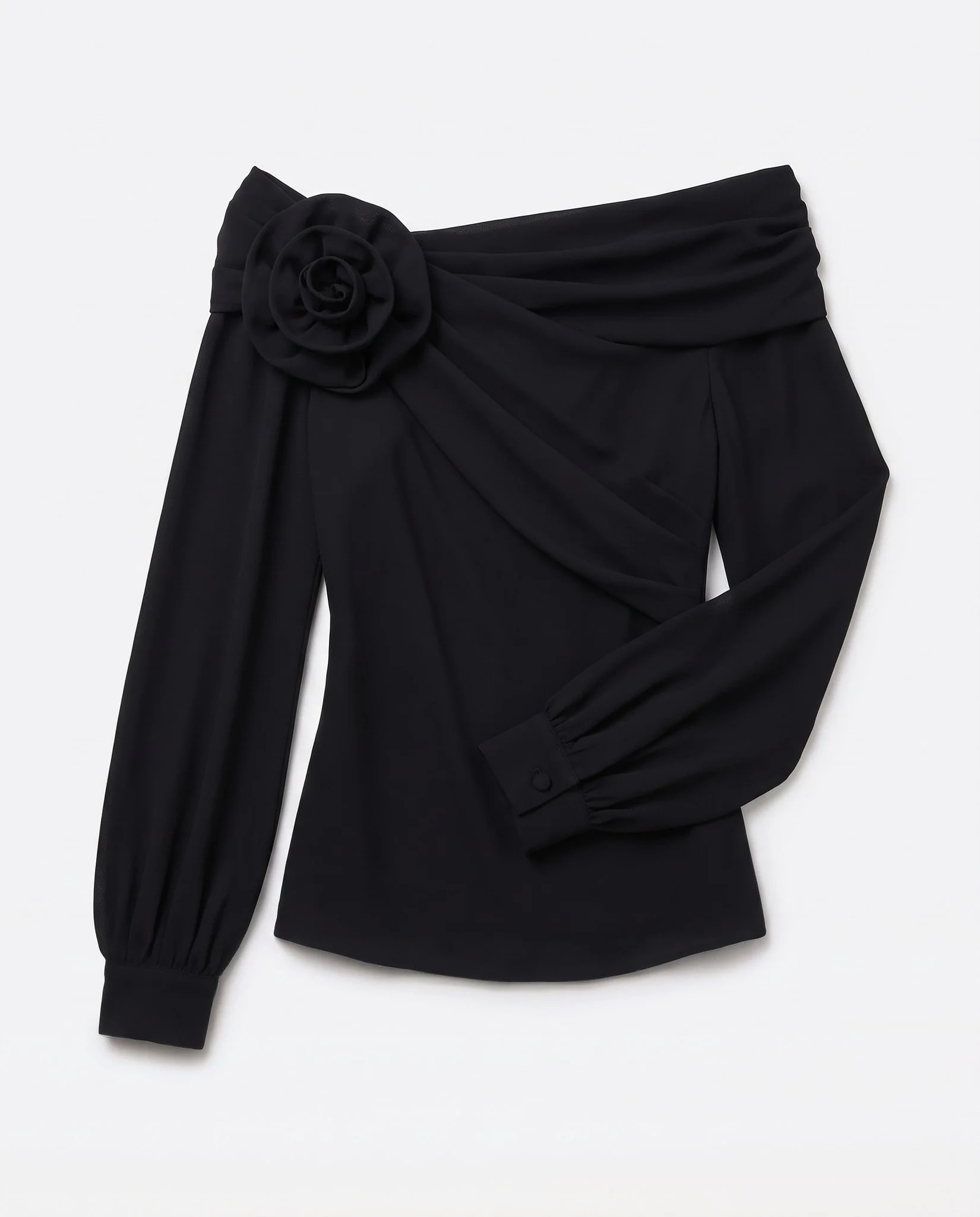 Black asymmetric top flat on studio background, opaque crepe and buttoned cuff