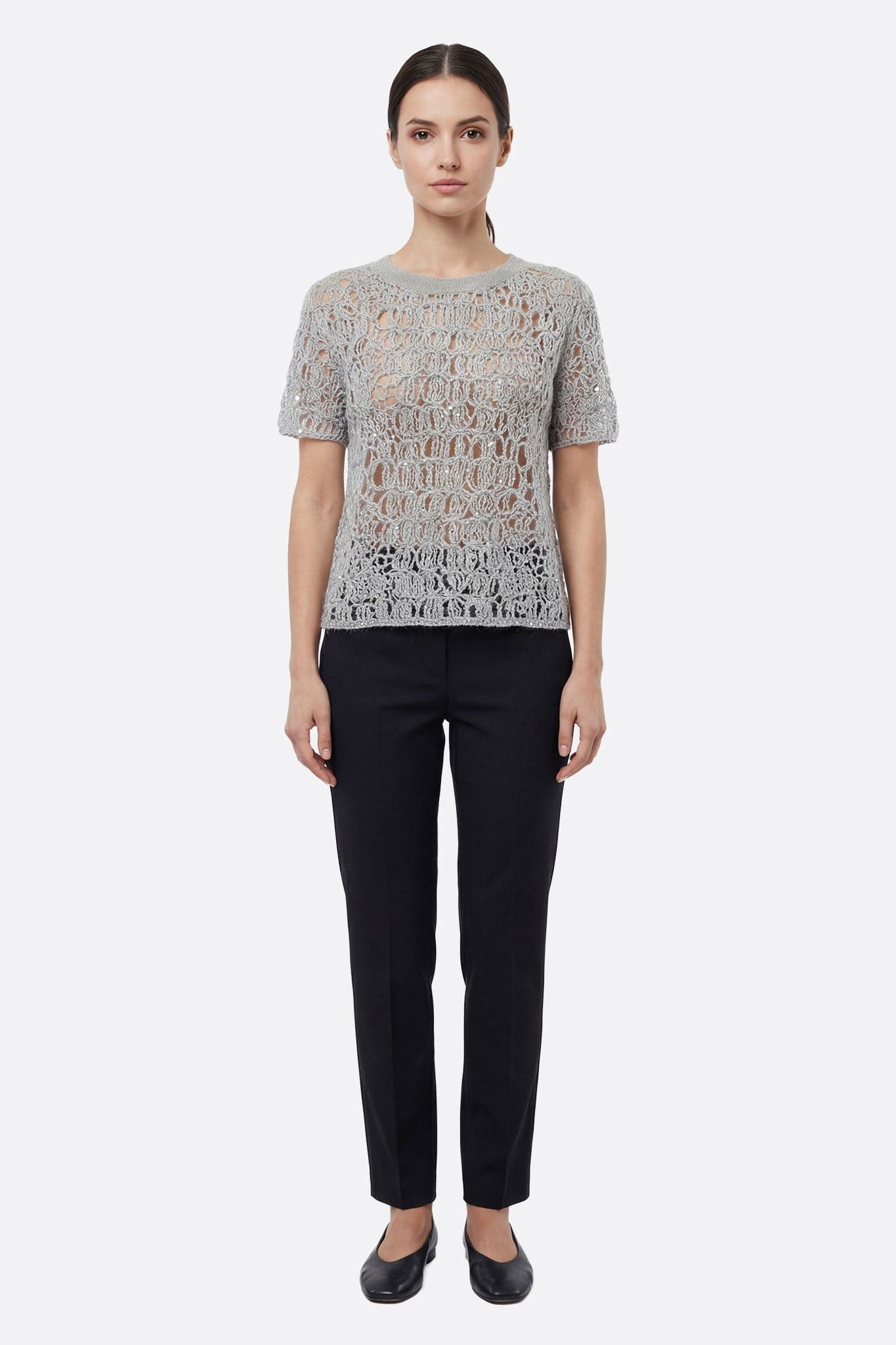 Captivating detail of the pearl gray openwork knit sweater with lurex, a chic piece to elevate a summer outfit.