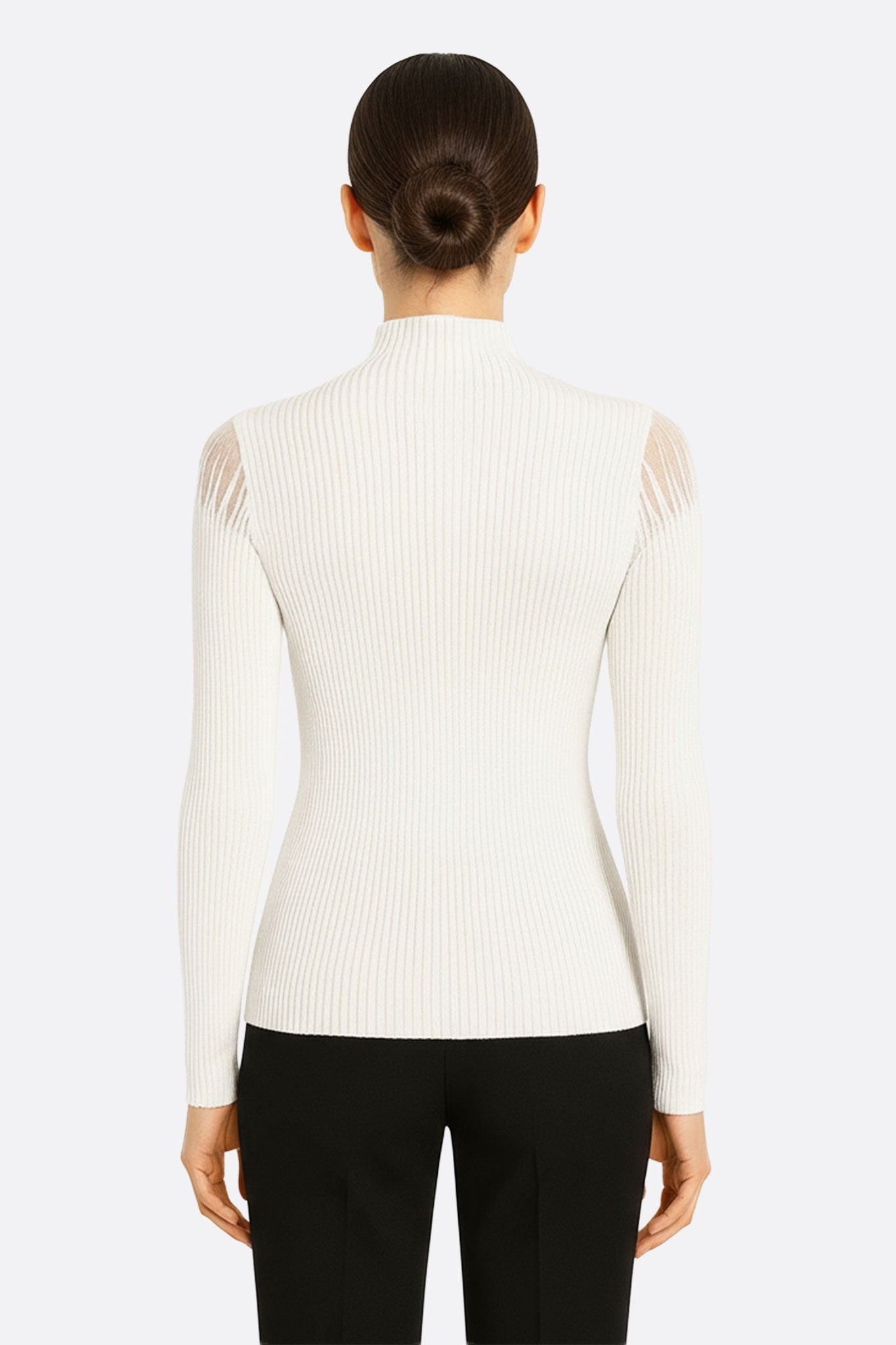 White knit pullover with long sleeves, three-quarter view emphasizing the transparent nude yoke for a modern look and...