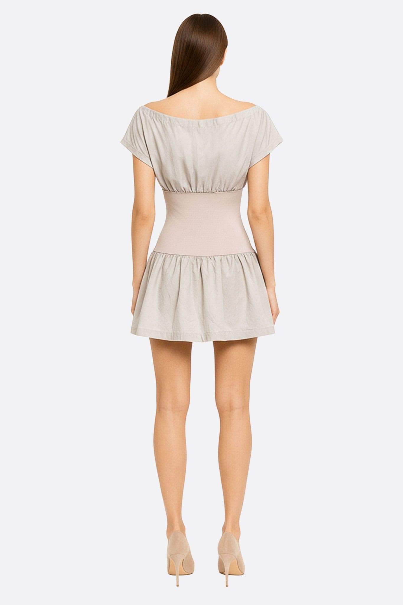 Short beige dress with empire waist in waffle cotton, highlighted from a 3/4 angle, perfect for a chic and modern look.