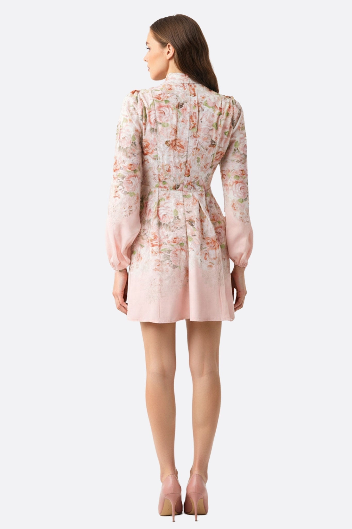 Rose dress with floral motifs, three-quarter view, accentuating the puffed sleeves and stand collar, ideal for an evening...