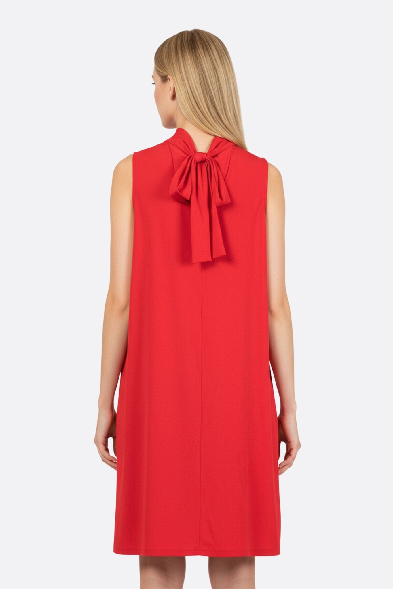Alternative view of the flowing red dress with draped neckline, emphasizing its elegance and lightness for a chic evening look.