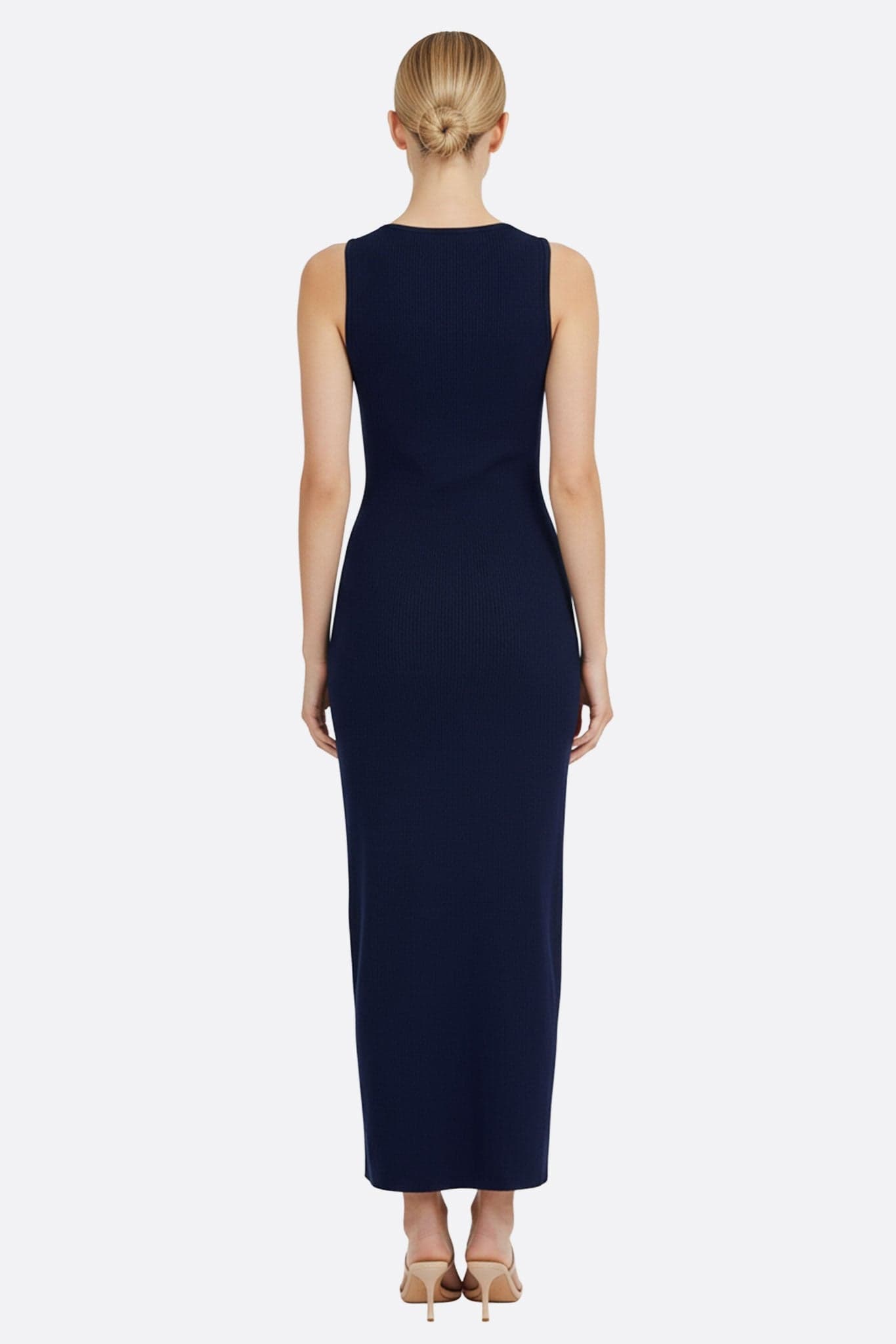Alternative view of the long navy blue ribbed knit dress, highlighting its elegant finishes and...