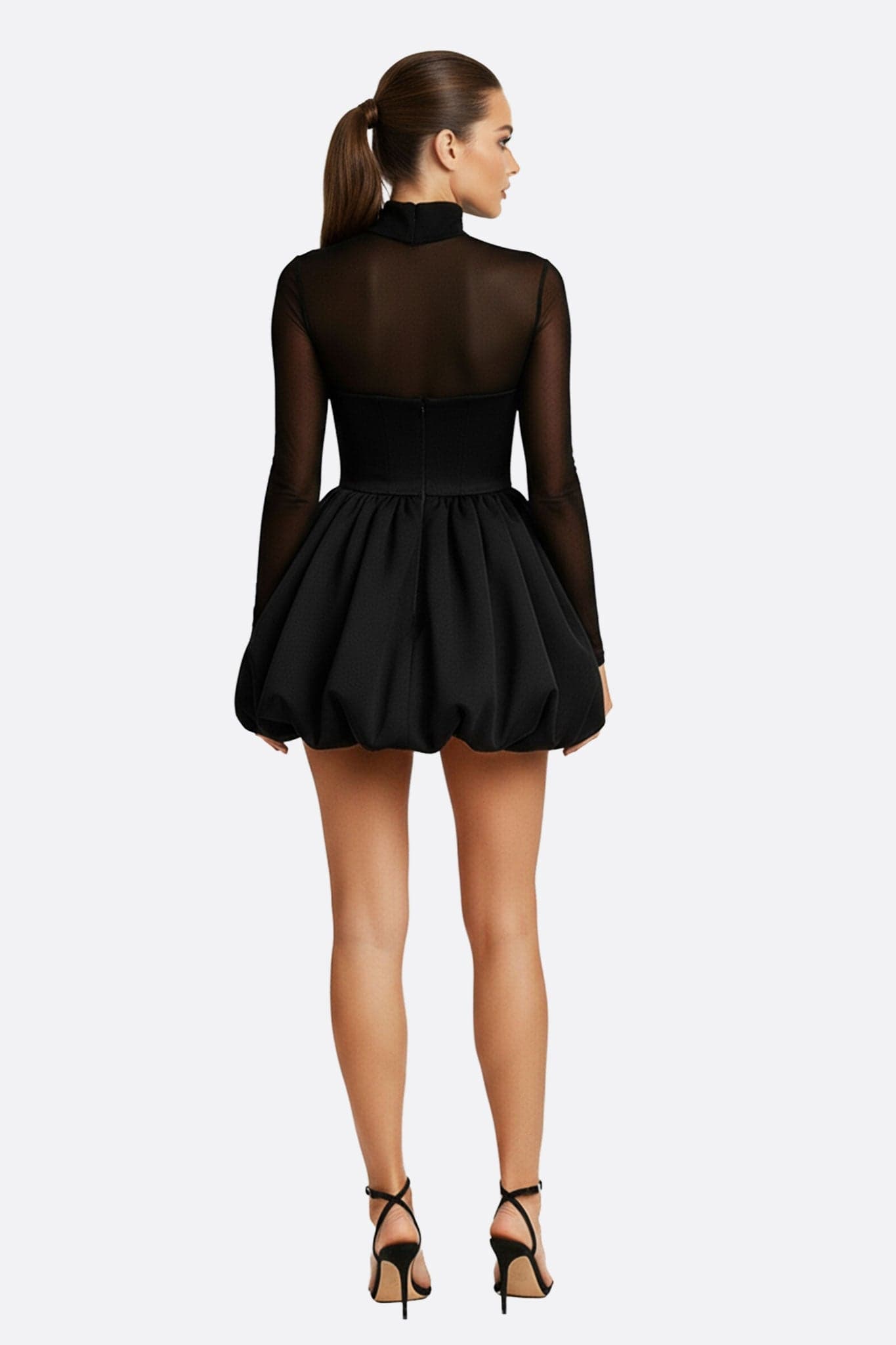 Elegant black dress with long tulle sleeves, three-quarter view, fluidity and sophistication for a memorable evening