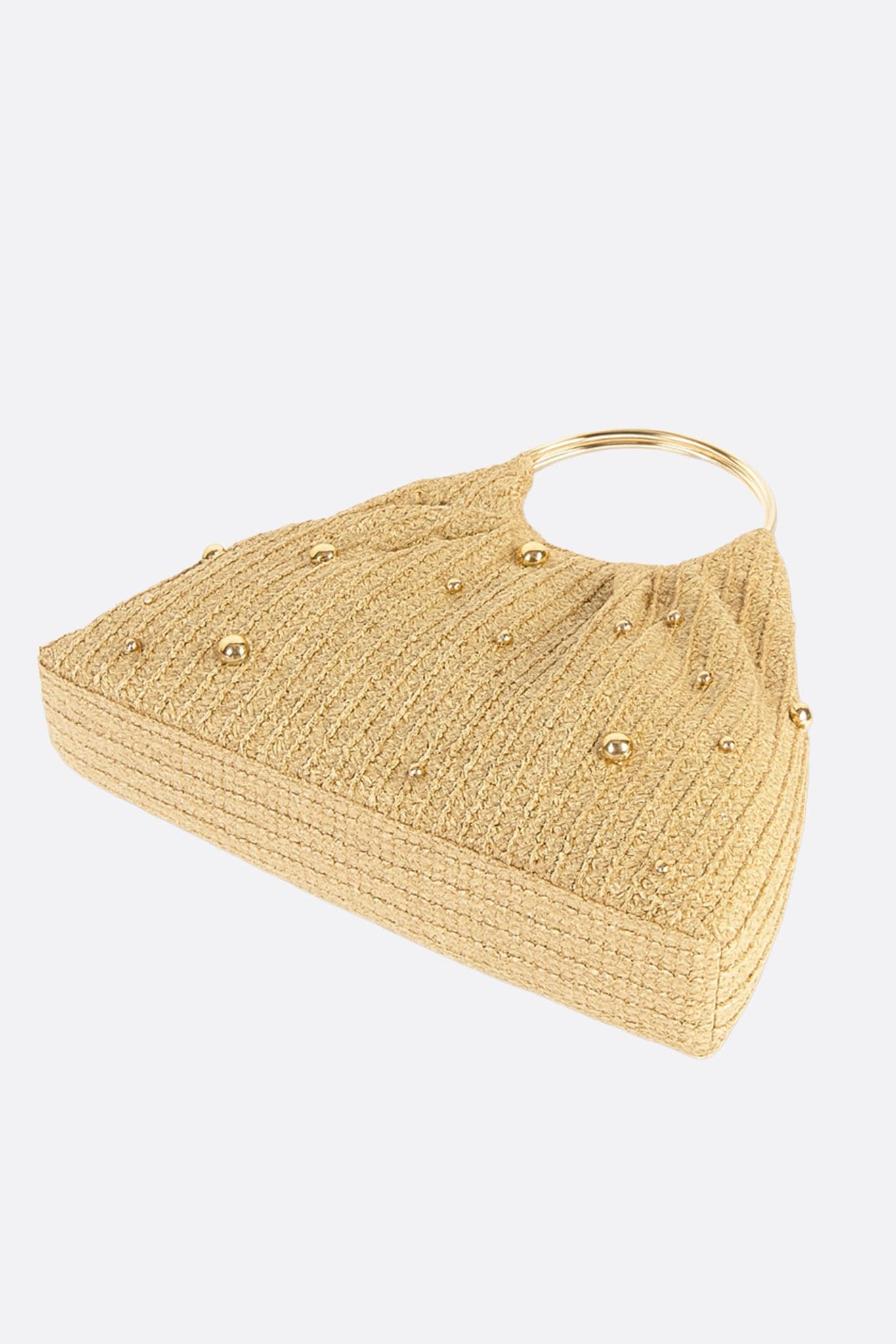 Texture of the golden raffia tote, accented with golden beads, perfect for elevating summer outfits with refinement