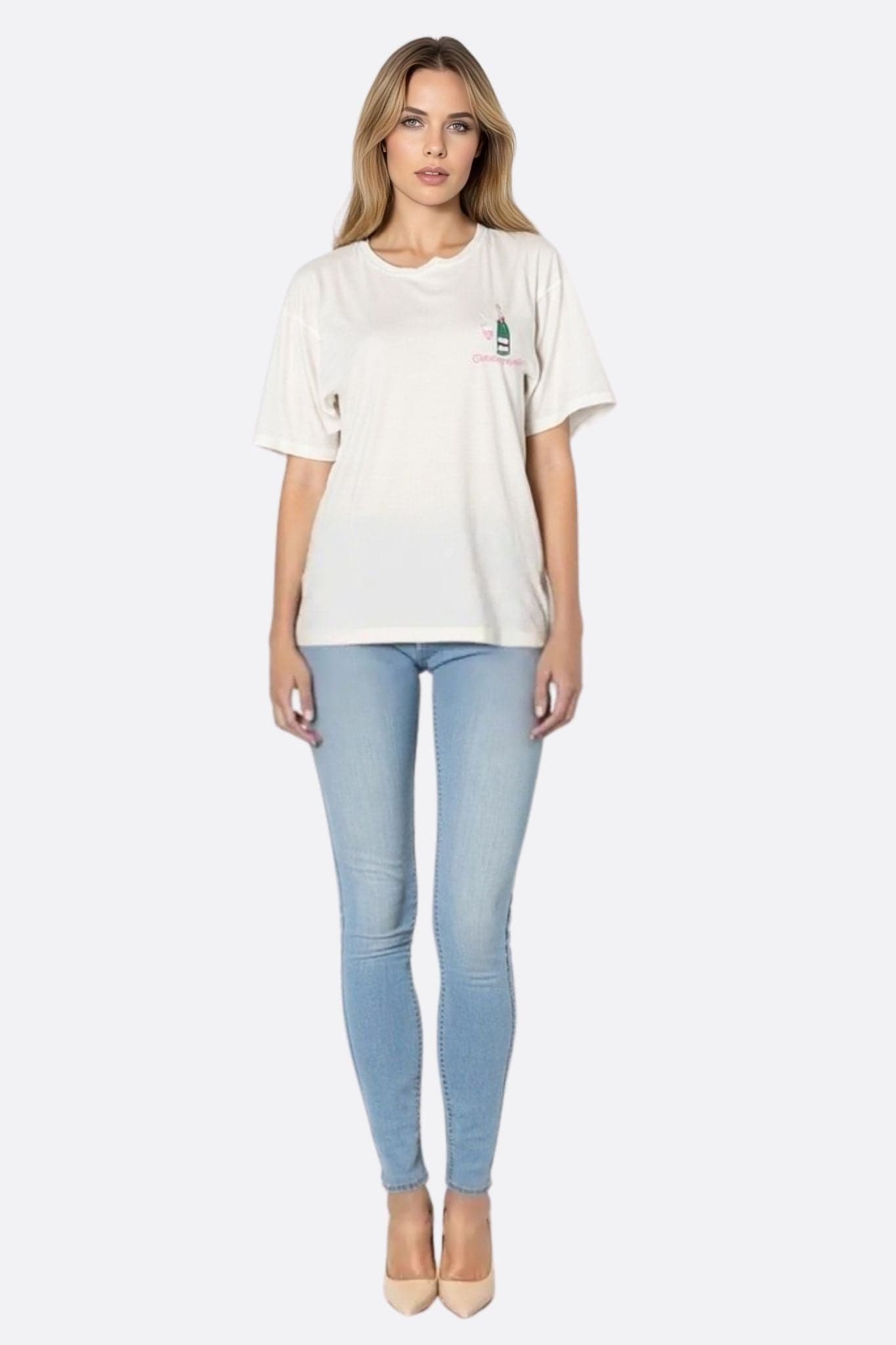 White oversized cotton T-shirt with champagne embroidery and rose cut, perfect for an elegant yet casual outfit.