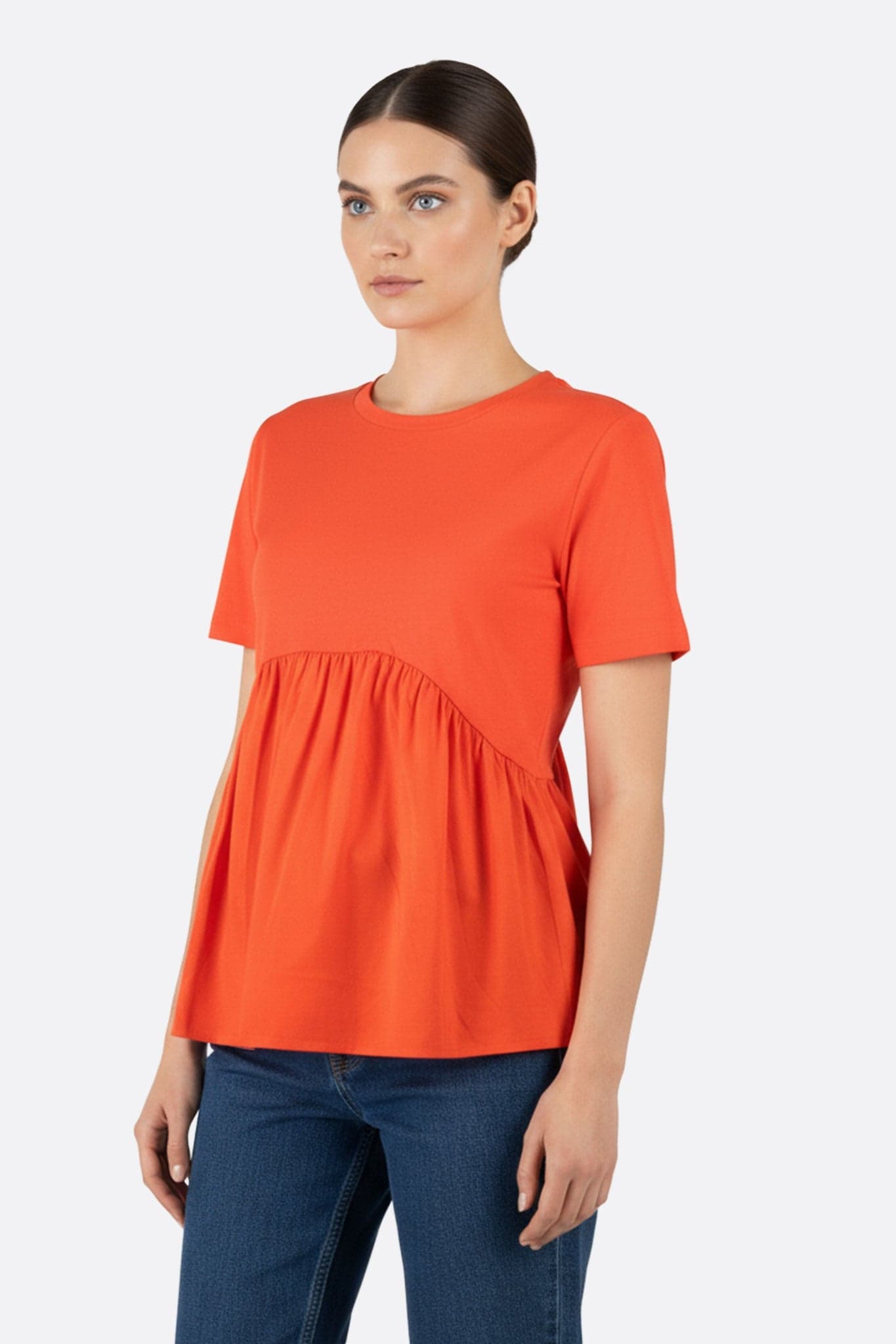 Coral t-shirt with a fluid cut, elegant ruching offering a refined look for casual outings or...