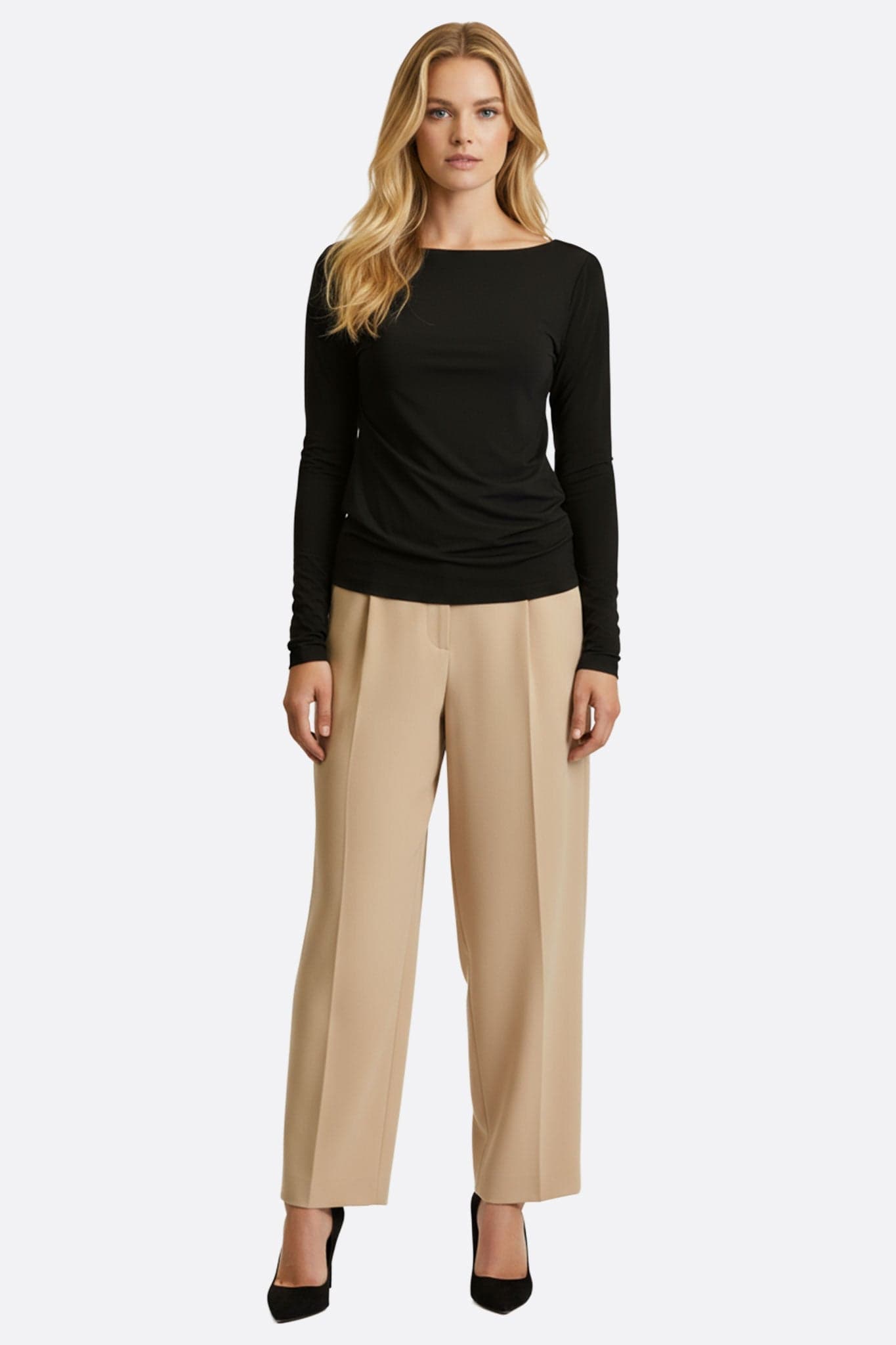 Close up on a black long sleeve top with a twisted bare back, a subtle blend of elegance and modernity.
