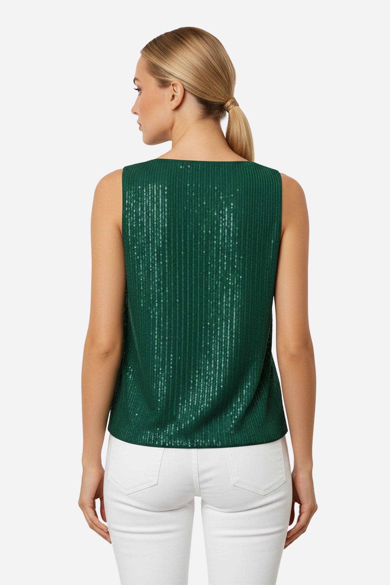 Shimmering texture of the sleeveless green top, adorned with sequins, perfect for a refined and modern evening look