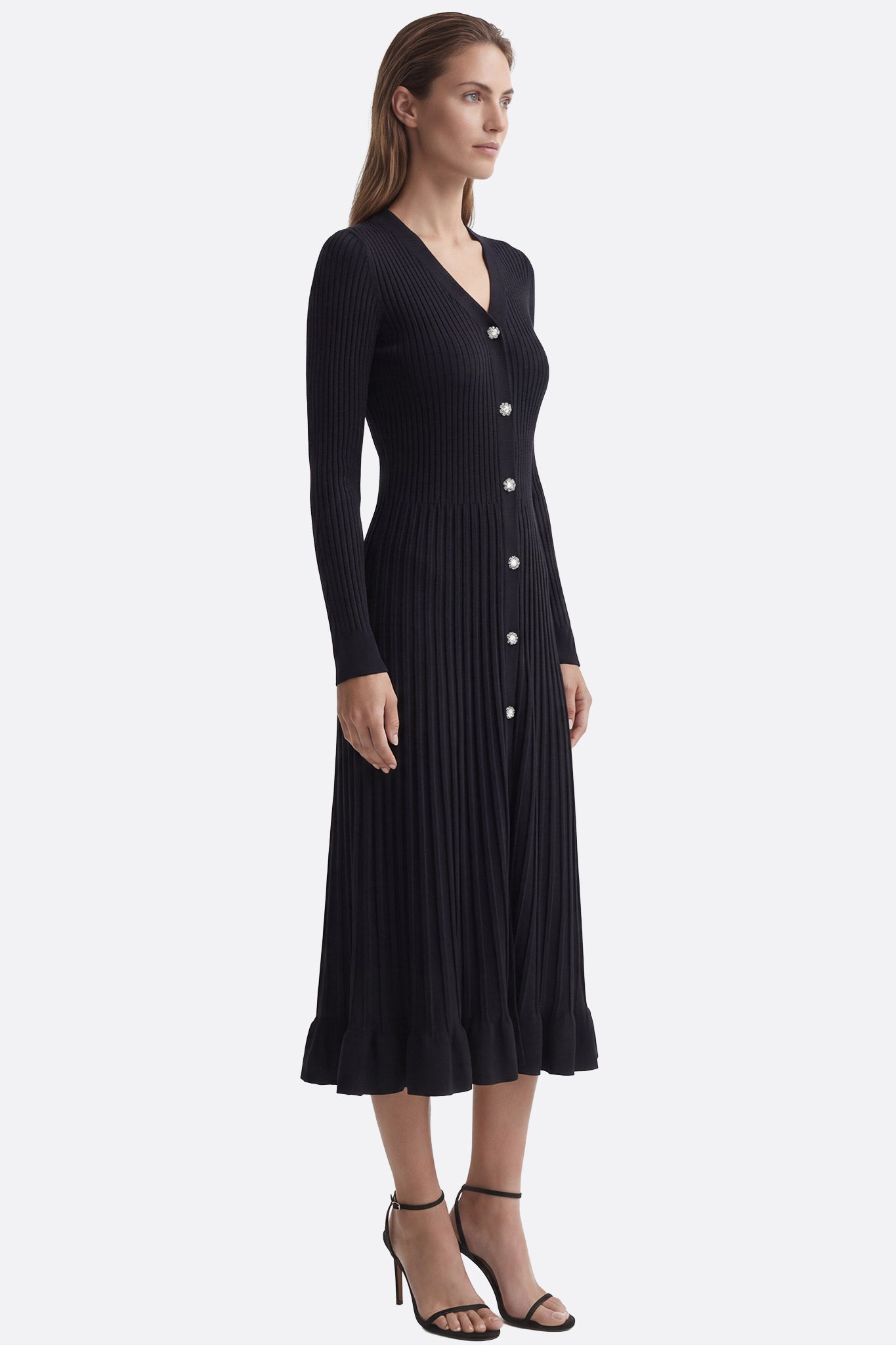 Schwarzes Midikleid aus gerippter Stoffqualität mit V-Ausschnitt, ideal für elegante Abendveranstaltungen und vielseitige...