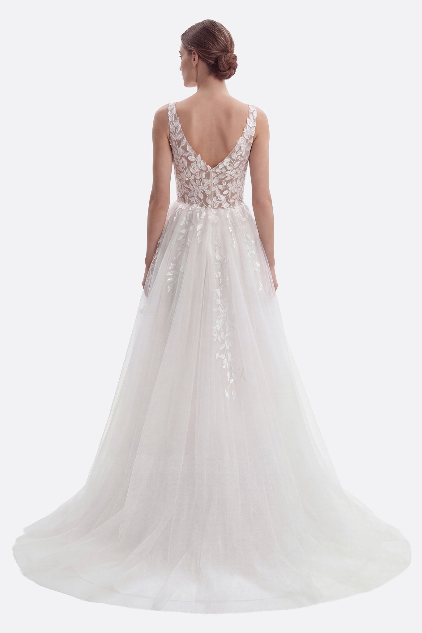 Flowing long tulle wedding dress with a V-neckline and intricate floral lace accents for a romantic bridal look.