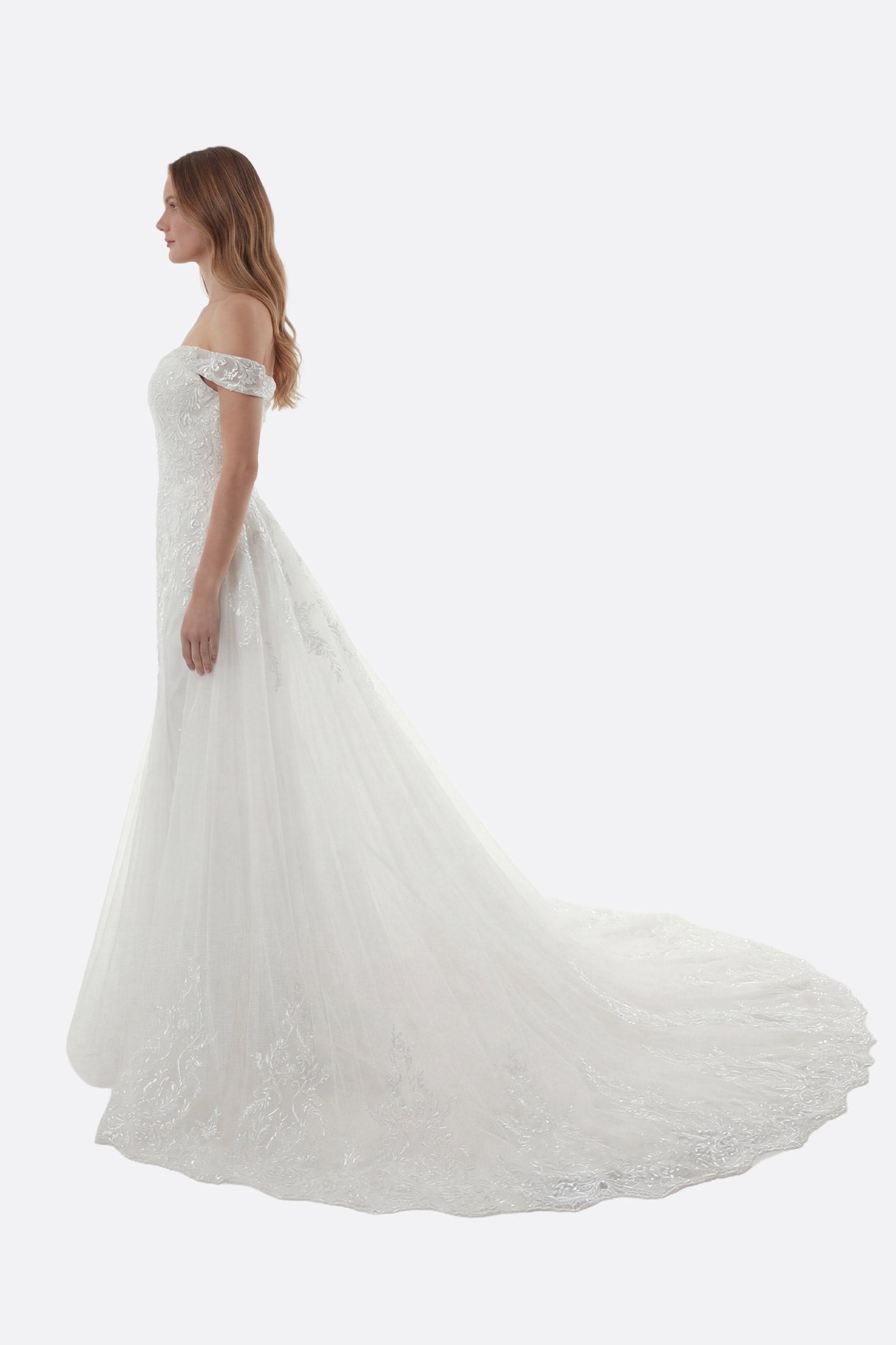 Elegant strapless mermaid wedding dress with a structured bodice and detachable train for a modern bridal silhouette.