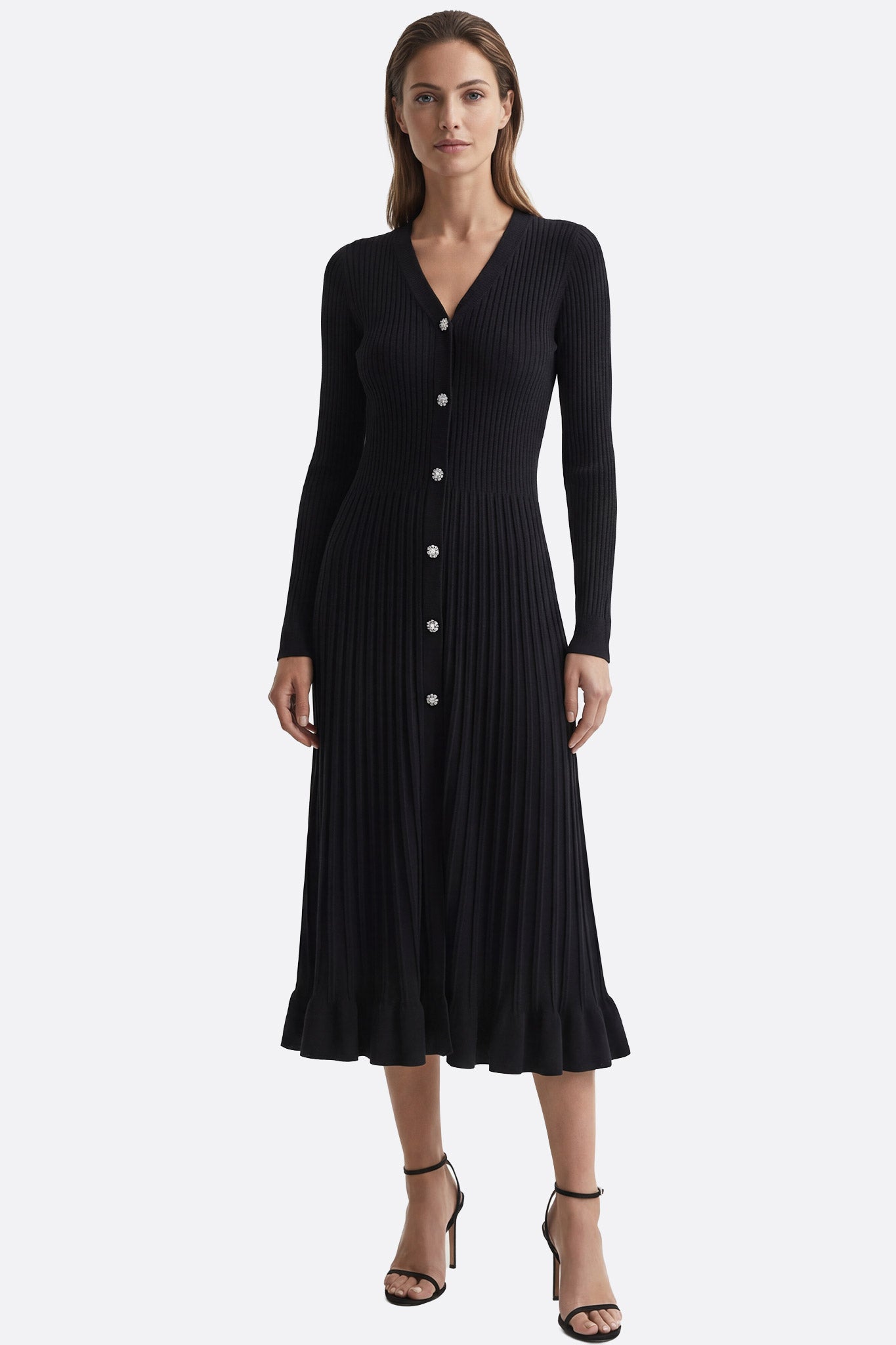 Schwarzes Midikleid aus gerippter Strickware mit V-Ausschnitt, perfekt für elegante Events und vielseitige Styling-Optionen.