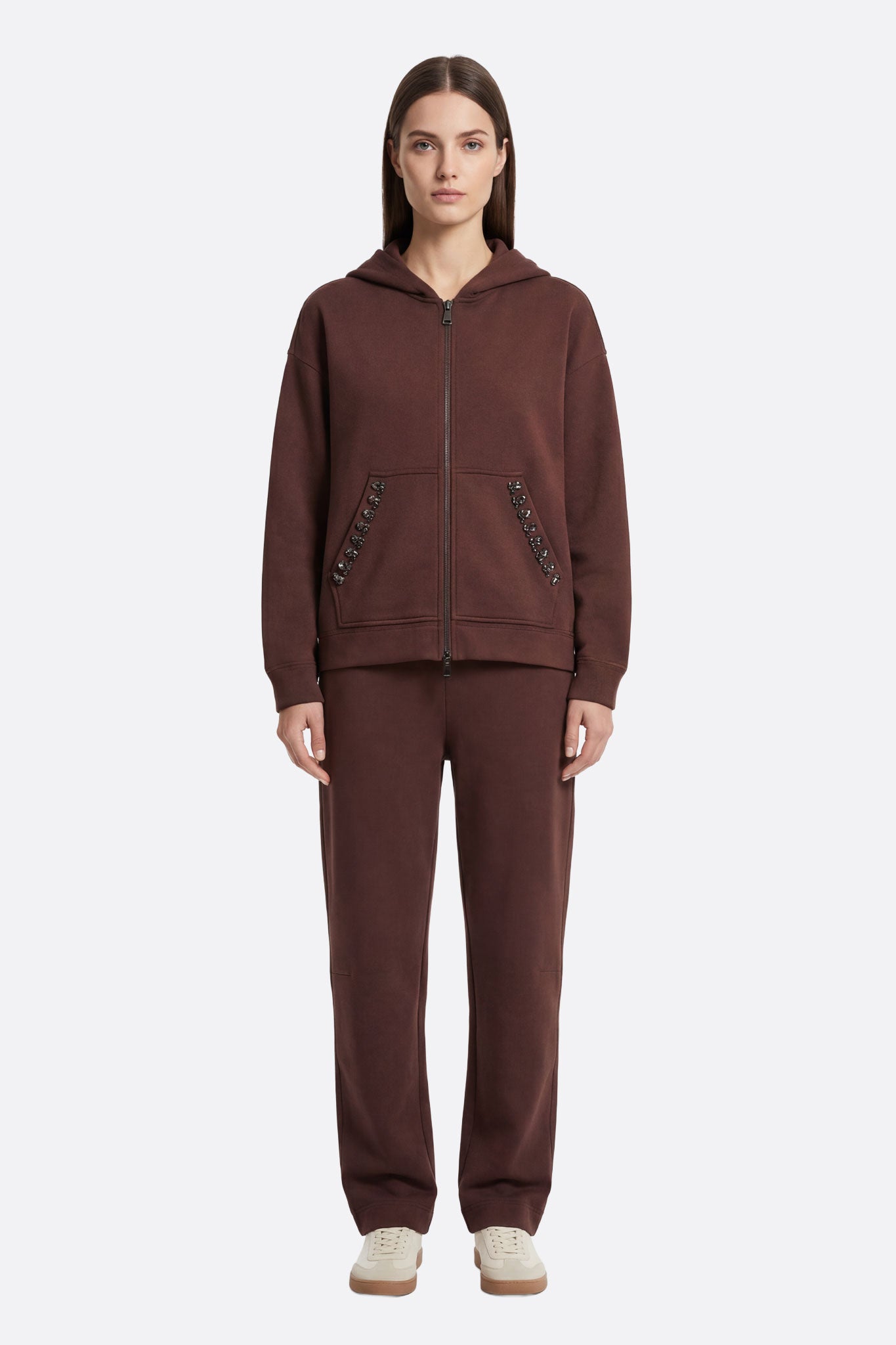 Chic brown tracksuit set adorned with faceted crystals for a modern and cozy look.