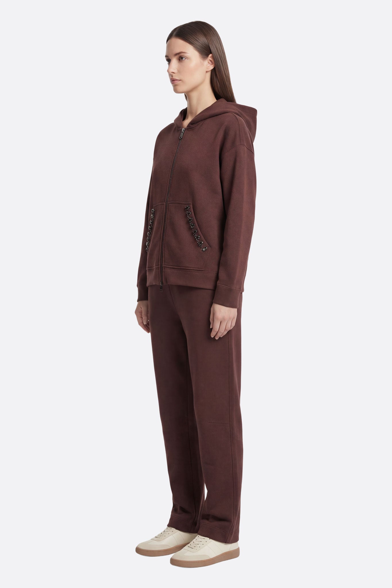 Elegant brown tracksuit featuring shimmering faceted crystals for a stylish and comfortable fit.