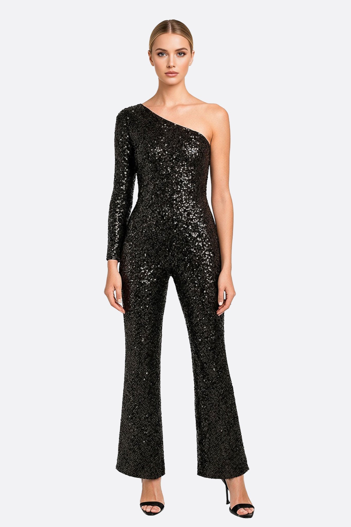 Combinazione asimmetrica nera con paillettes, elegante e sofisticata, ideale per eventi speciali e serate raffinate.