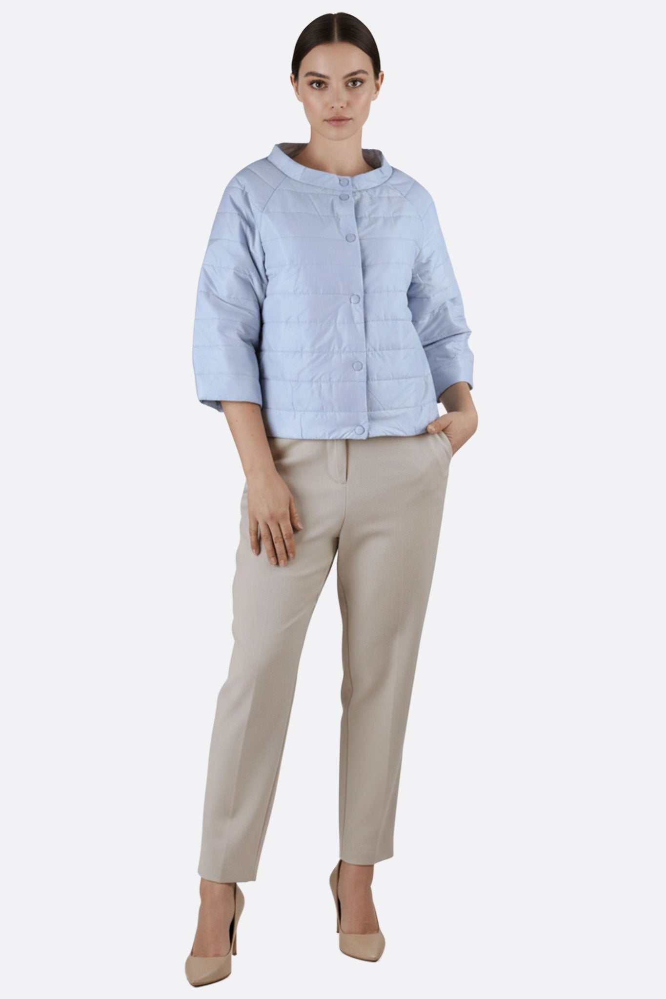 Textured light blue sky puffer jacket with 3/4 sleeves, highlighting refined details for effortless elegance and comfort.