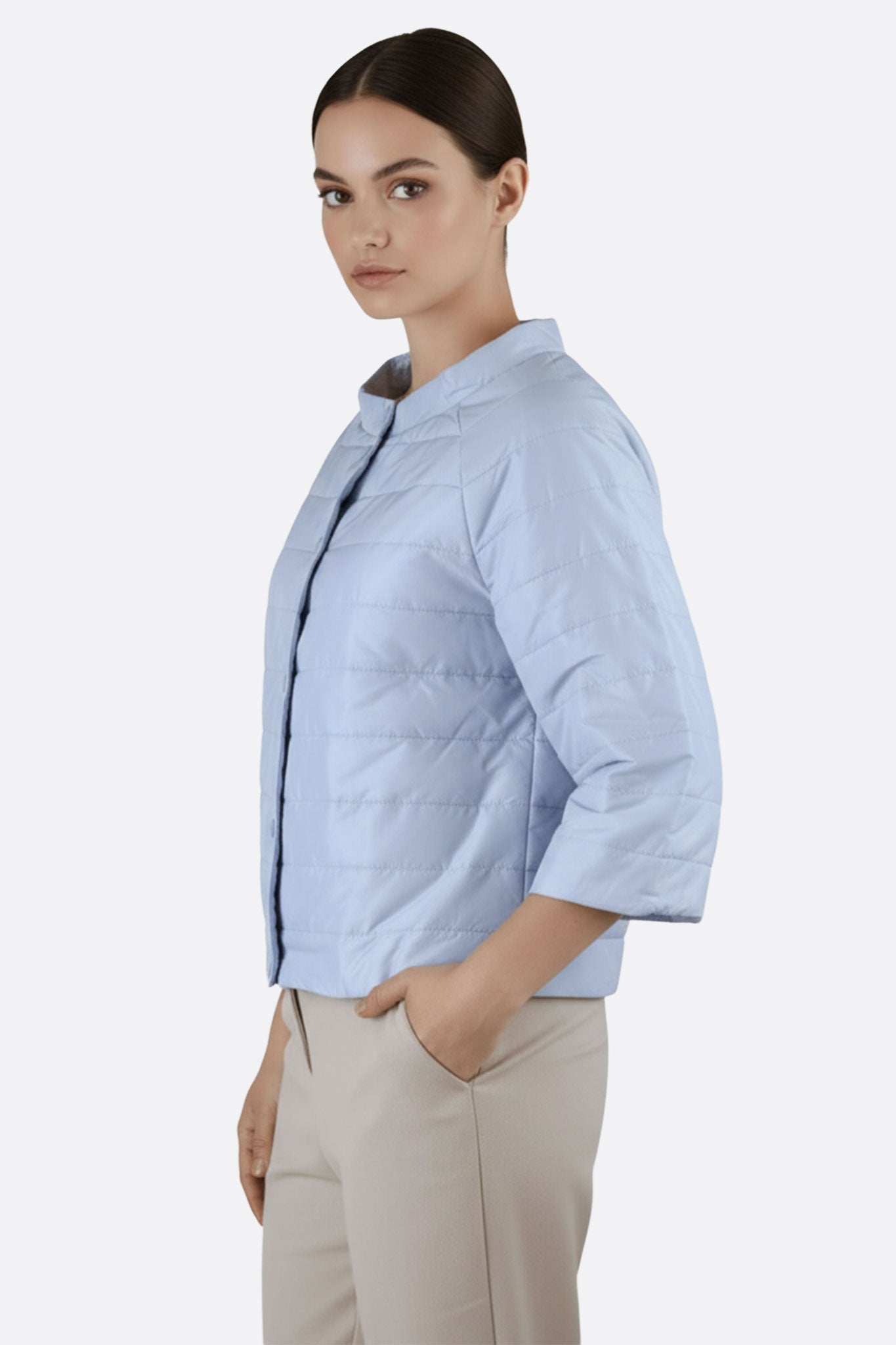 Elegant light sky blue short puffer jacket with three-quarter sleeves, ideal for casual chic moments and stylish evenings.