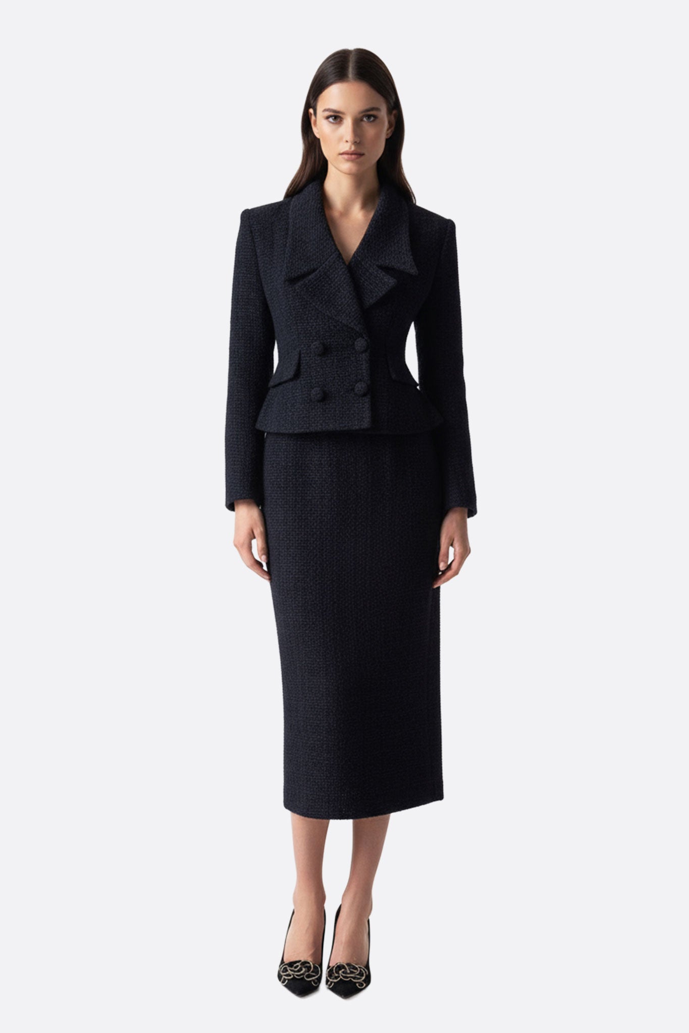 Conjunto de traje femenino de dos piezas en lana negra, elegante y cómodo, perfecto para ocasiones formales o en la oficina.